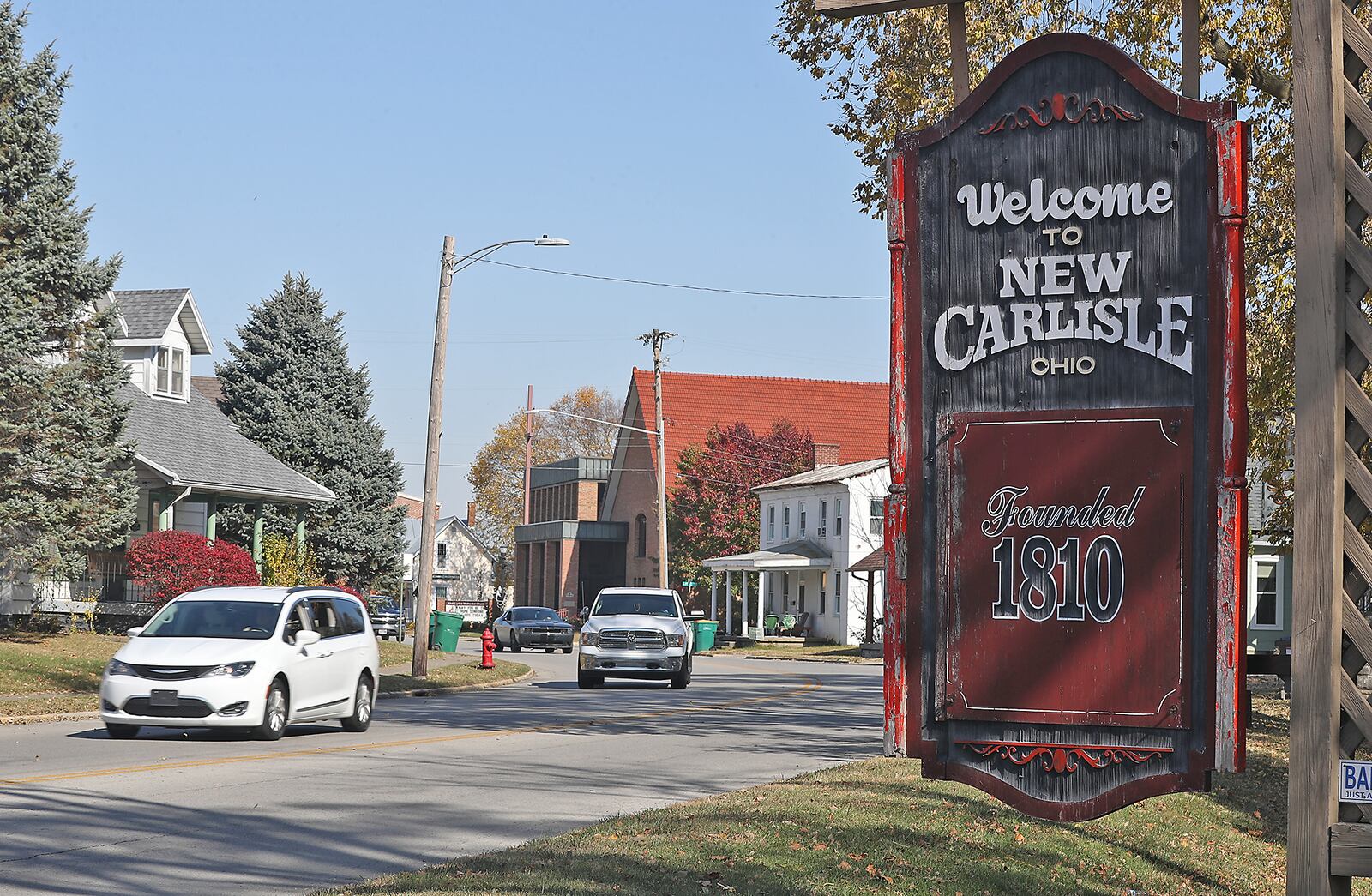 Cars travel past a "Welcome to New Carlisle Ohio" sign on Ohio Rt. 235 Monday, Oct. 24, 2022. BILL LACKEY/STAFF