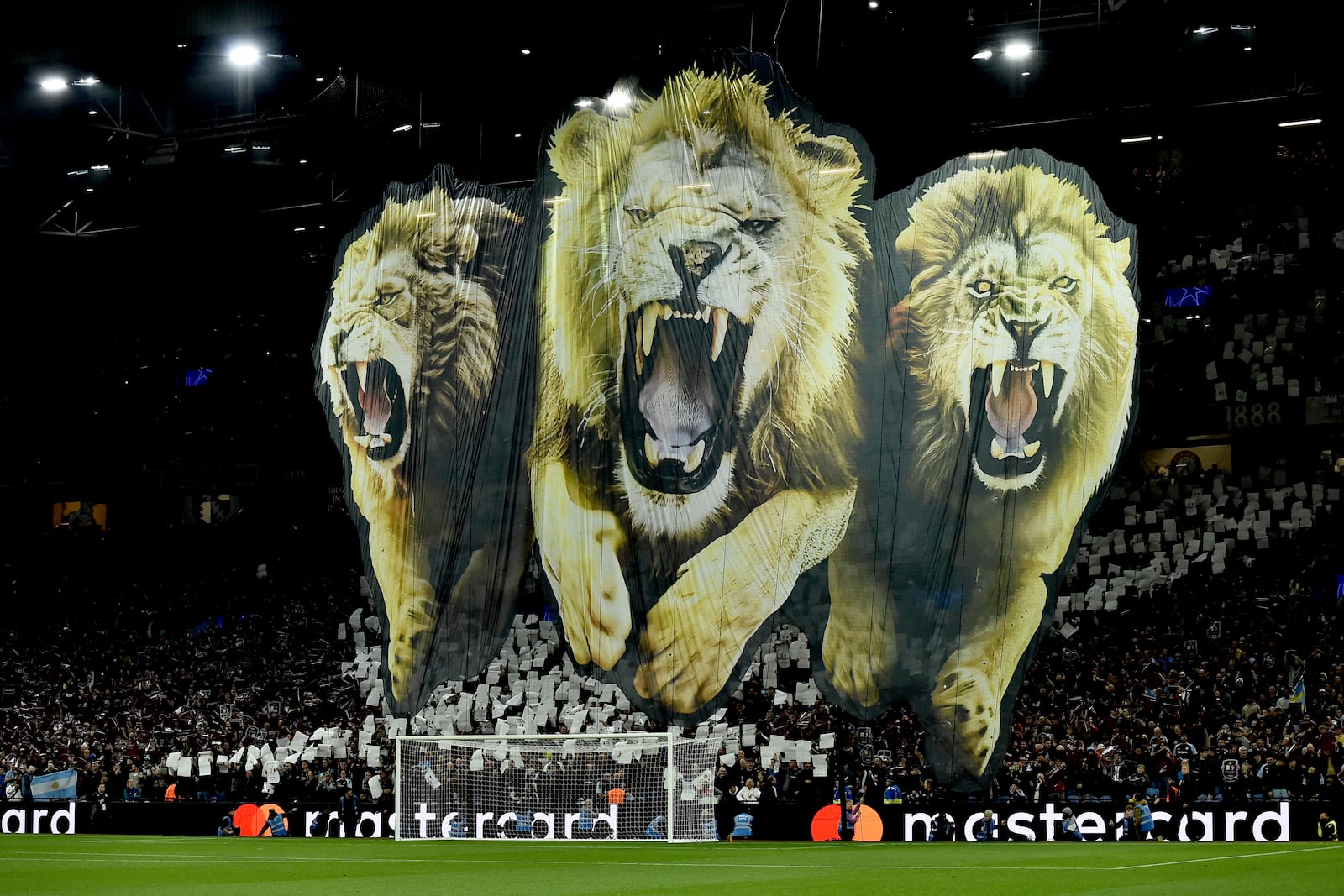 Fans unveil a giant banner prior to the Champions League opening phase soccer match between Aston Villa and Bologna at the Villa Park in Birmingham, England, Tuesday, Oct. 22, 2024. (AP Photo/Rui Vieira)