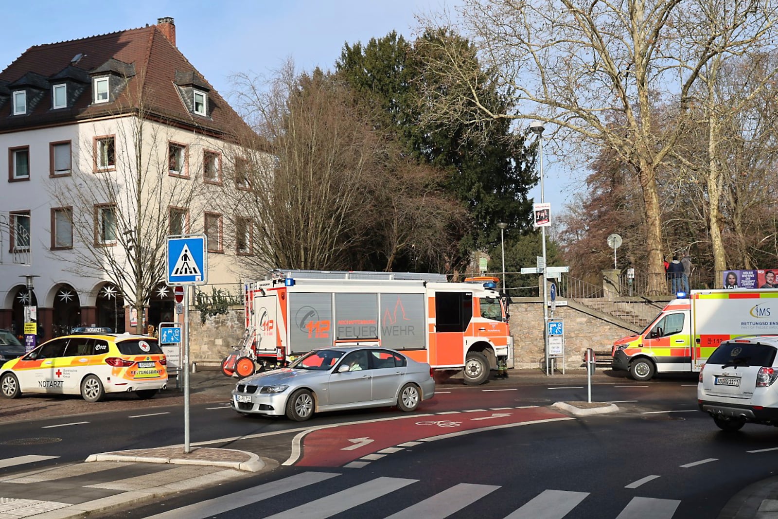 Rescue vehicles are seen near a crime scene in Aschaffenburg, Germany, Wednesday, Jan 22, 2025, where two people were killed in a knife attack. (Ralf Hettler/dpa via AP)