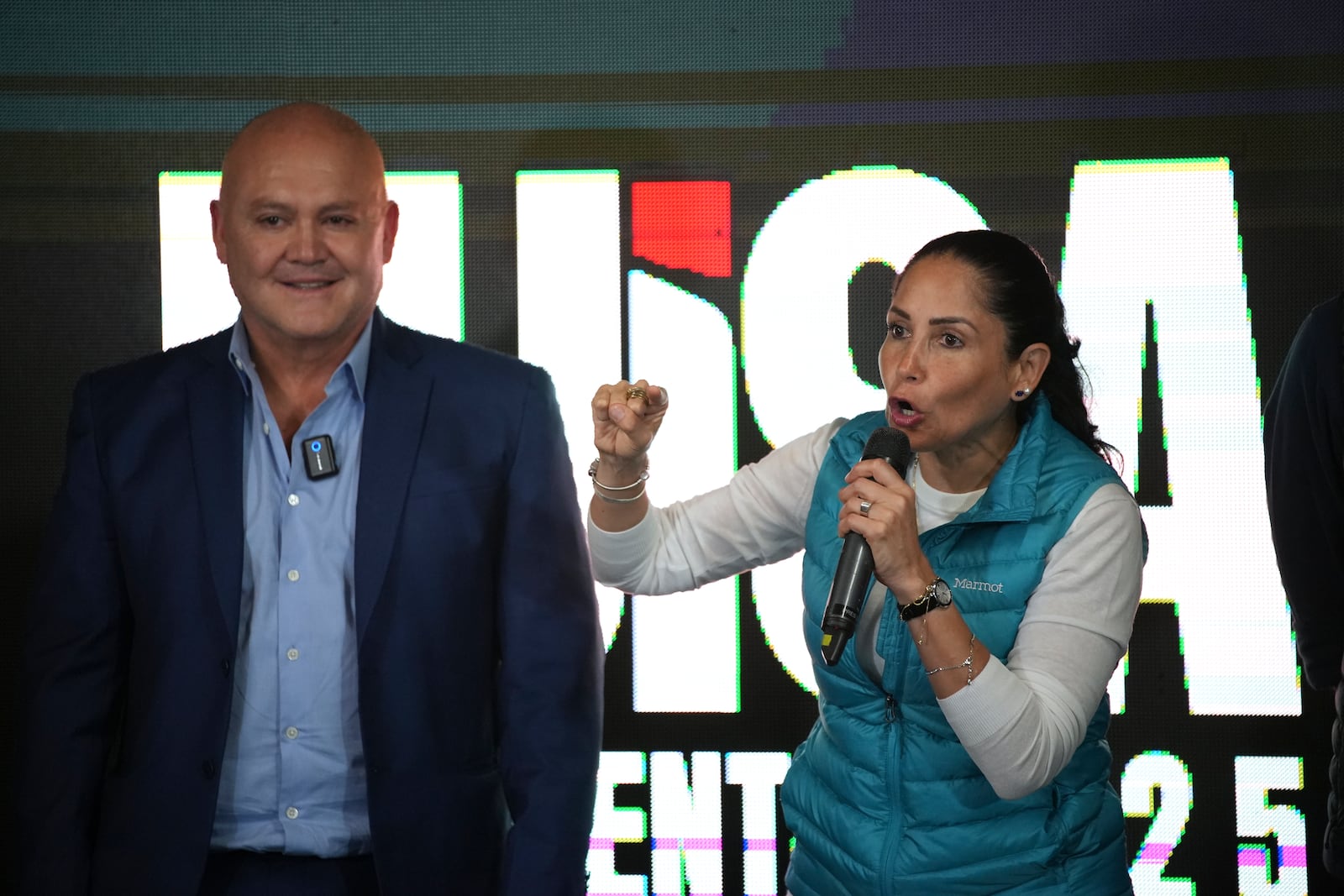 Luisa Gonzalez, presidential candidate for the Citizen Revolution Movement, speaks next to her running mate, Diego Borja, after polls closed for the presidential election in Quito, Ecuador, Sunday, Feb. 9, 2025. (AP Photo/Carlos Noriega)