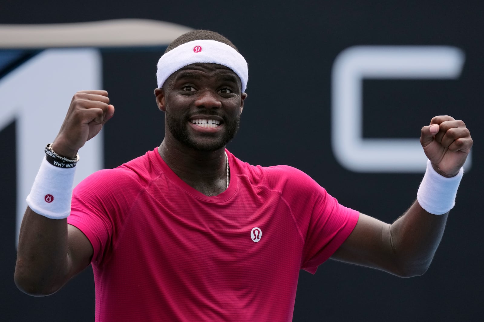 Frances Tiafoe of the U.S. celebrates after defeating Arthur Rinderknech of France in their first round match at the Australian Open tennis championship in Melbourne, Australia, Monday, Jan. 13, 2025. (AP Photo/Vincent Thian)