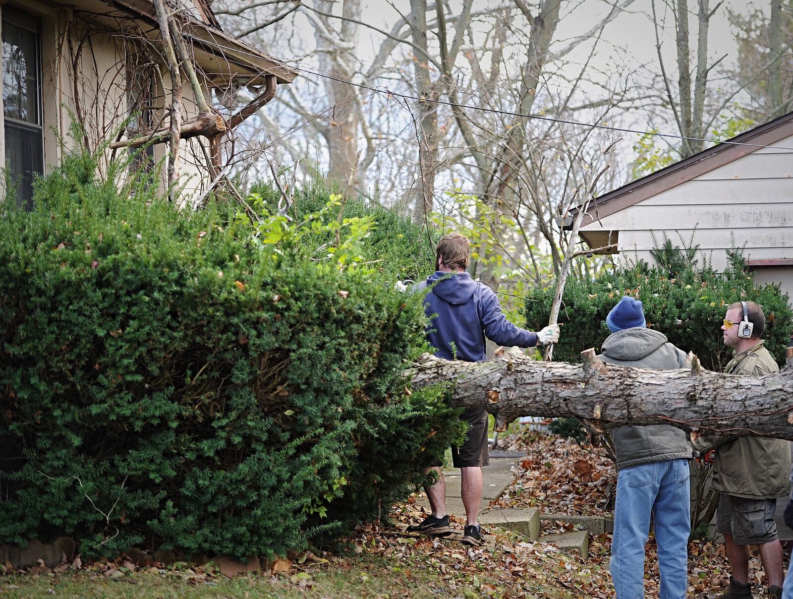 Due to Highwinds and severe weather a tree fell crashing a car and hitting at home on Valley View Drive in Fairborn Sunday afternoon. MARSHALL GORBY\ STAFF