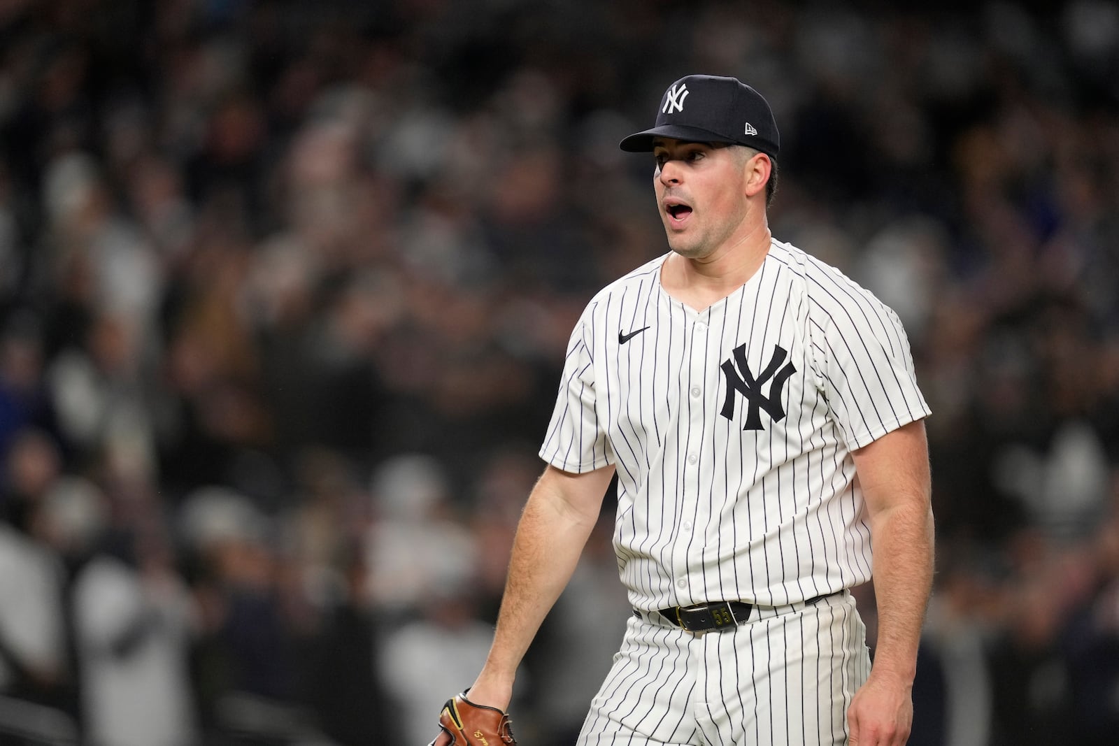 New York Yankees starting pitcher Carlos Rodón reacts while throwing against the Cleveland Guardians during the sixth inning in Game 1 of the baseball AL Championship Series Monday, Oct. 14, 2024, in New York. (AP Photo/Godofredo Vásquez)