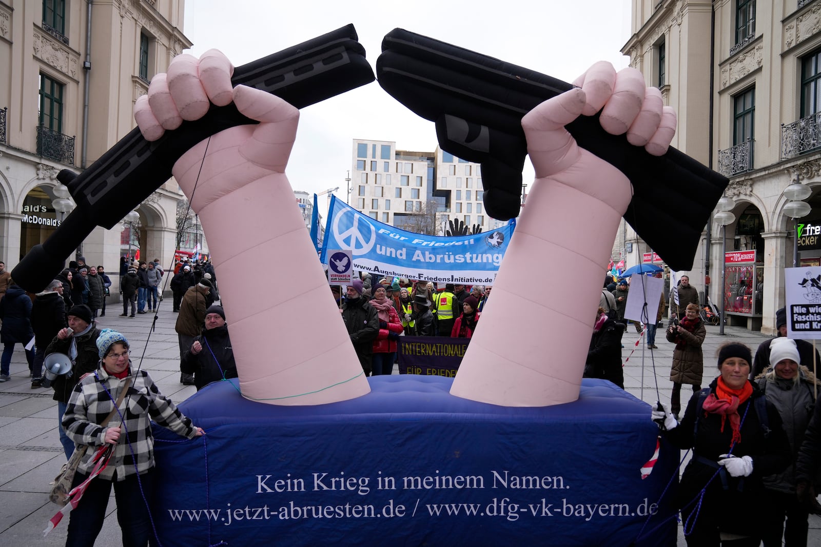 Protestors march during a demonstration against the Munich Security Conference in Munich, Saturday, Feb. 15, 2025. Slogan in front of reads : .No war in my name' and in the background: 'For Peace and disarmament'.(AP Photo/Ebrahim Noroozi)