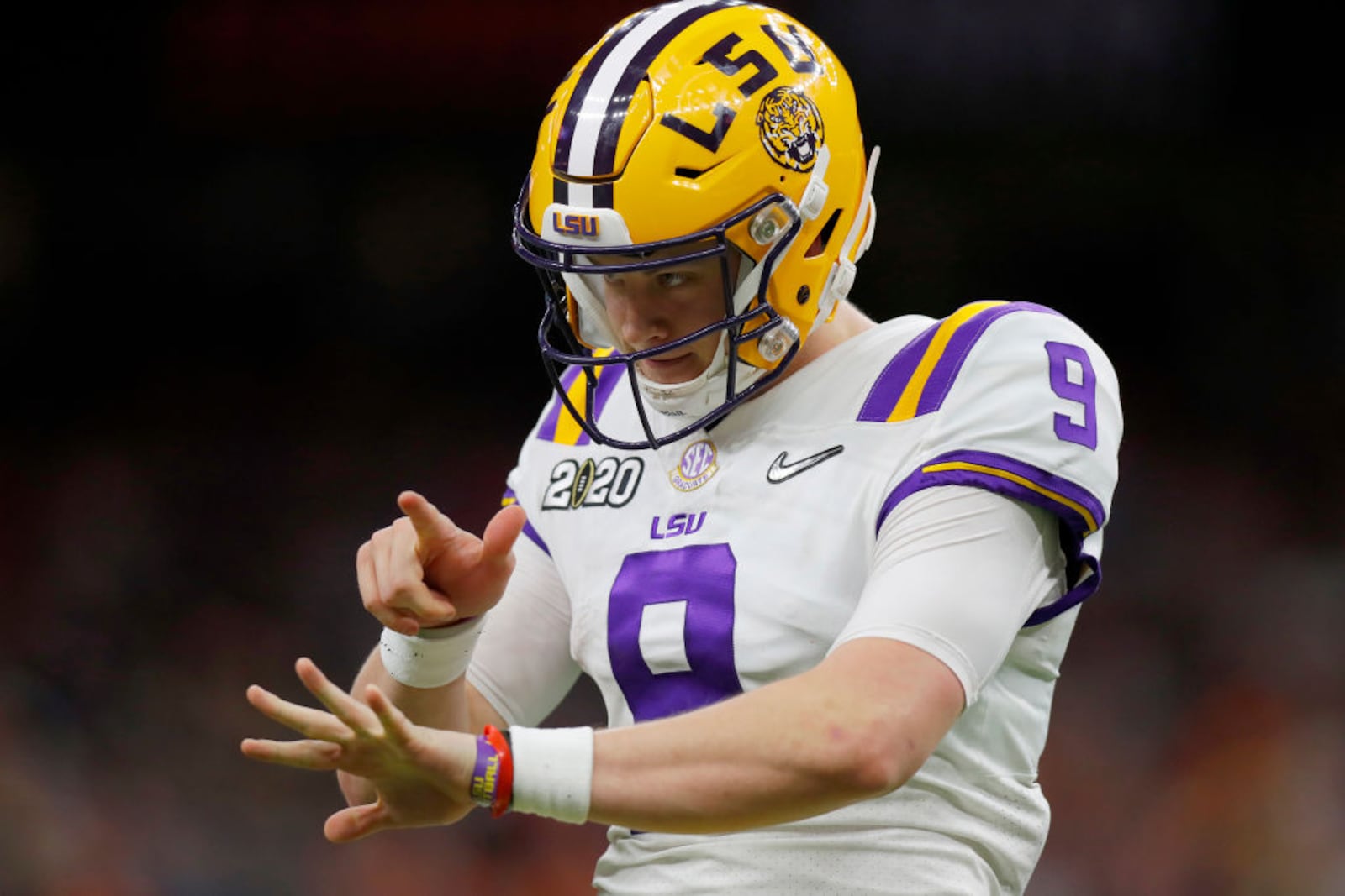 NEW ORLEANS, LOUISIANA - JANUARY 13: Joe Burrow #9 of the LSU Tigers reacts to a touchdown against Clemson Tigers during the third quarter in the College Football Playoff National Championship game at Mercedes Benz Superdome on January 13, 2020 in New Orleans, Louisiana. (Photo by Jonathan Bachman/Getty Images)