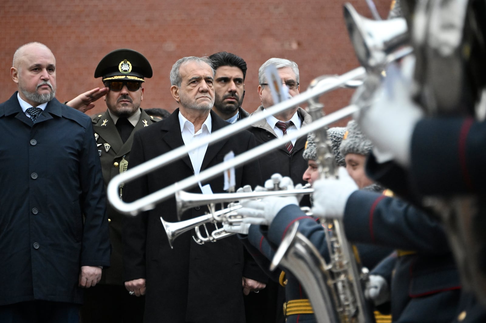 Iranian President Masoud Pezeshkian, centre, attends a laying ceremony at the Unknown Soldier near the Kremlin Wall in Moscow, Russia, Friday, Jan. 17, 2025. (Alexander Nemenov/Pool Photo via AP)