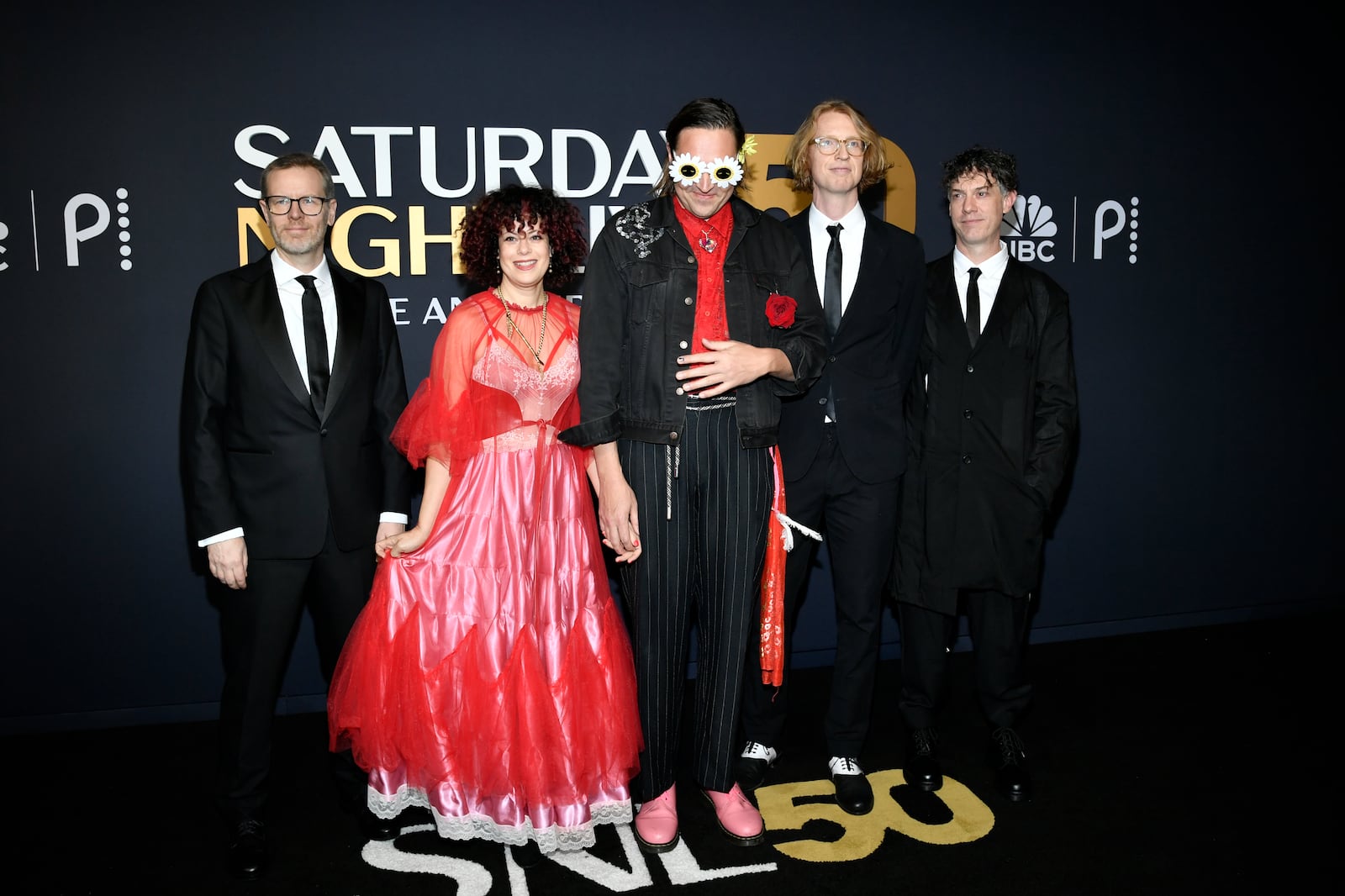 Tim Kingsbury, from left, Regine Chassagne, Win Butler, Richard Reed Parry, and Jeremy Gara of Arcade Fire attend "SNL50: The Anniversary Special" at Rockefeller Plaza on Sunday, Feb. 16, 2025, in New York. (Photo by Evan Agostini/Invision/AP)