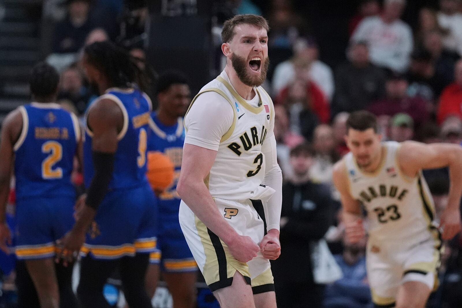 Purdue guard Braden Smith (3) celebrates while taking a lead against McNeese State during the first half in the second round of the NCAA college basketball tournament, Saturday, March 22, 2025, in Providence, R.I. (AP Photo/Charles Krupa)