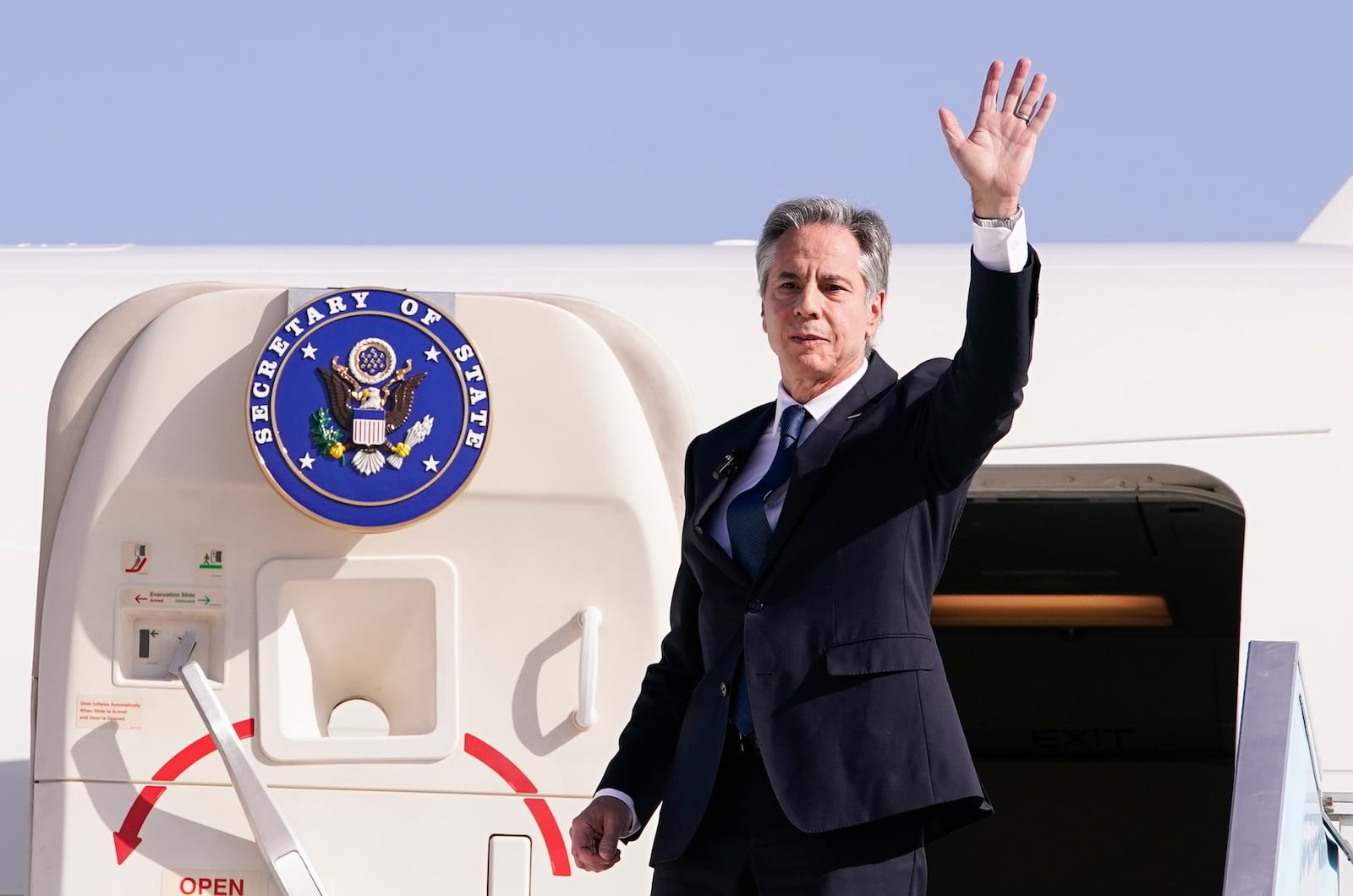 U.S. Secretary of State Antony Blinken waves as he departs for Riyadh, Saudi Arabia, from Ben Gurion International Airport in Tel Aviv, Israel, Wednesday, Oct. 23, 2024. (Nathan Howard/Pool Photo via AP)