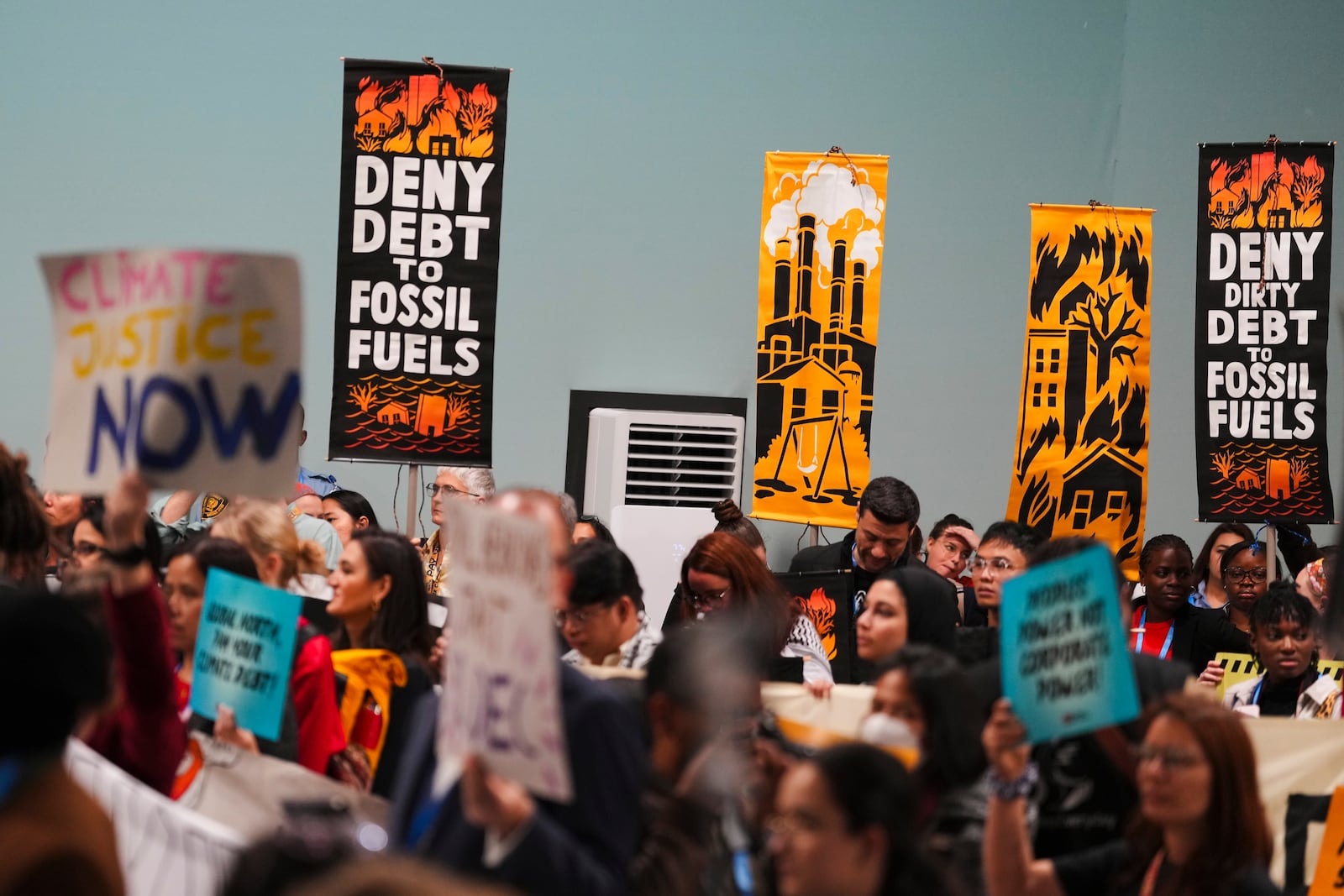 Activists participate in a demonstration against fossil fuels at the COP29 U.N. Climate Summit, Saturday, Nov. 16, 2024, in Baku, Azerbaijan. (AP Photo/Peter Dejong)