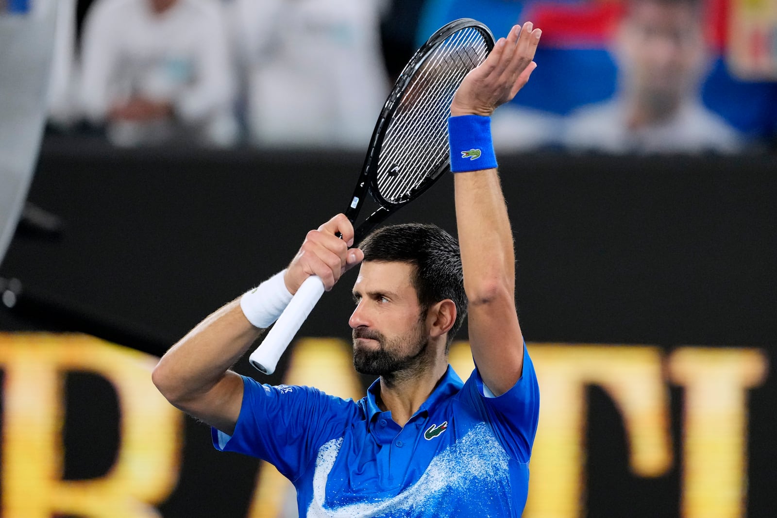 Novak Djokovic of Serbia celebrates after defeating Jaime Faria of Portugal in their second round match at the Australian Open tennis championship in Melbourne, Australia, Wednesday, Jan. 15, 2025. (AP Photo/Vincent Thian)