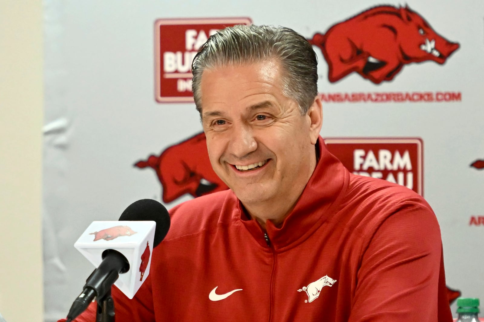 FILE - John Calipari answers questions from reporters during a press conference after being introduced as Arkansas's head head basketball coach Wednesday, April 10, 2024, in Fayetteville, Ark. (AP Photo/Michael Woods, File)