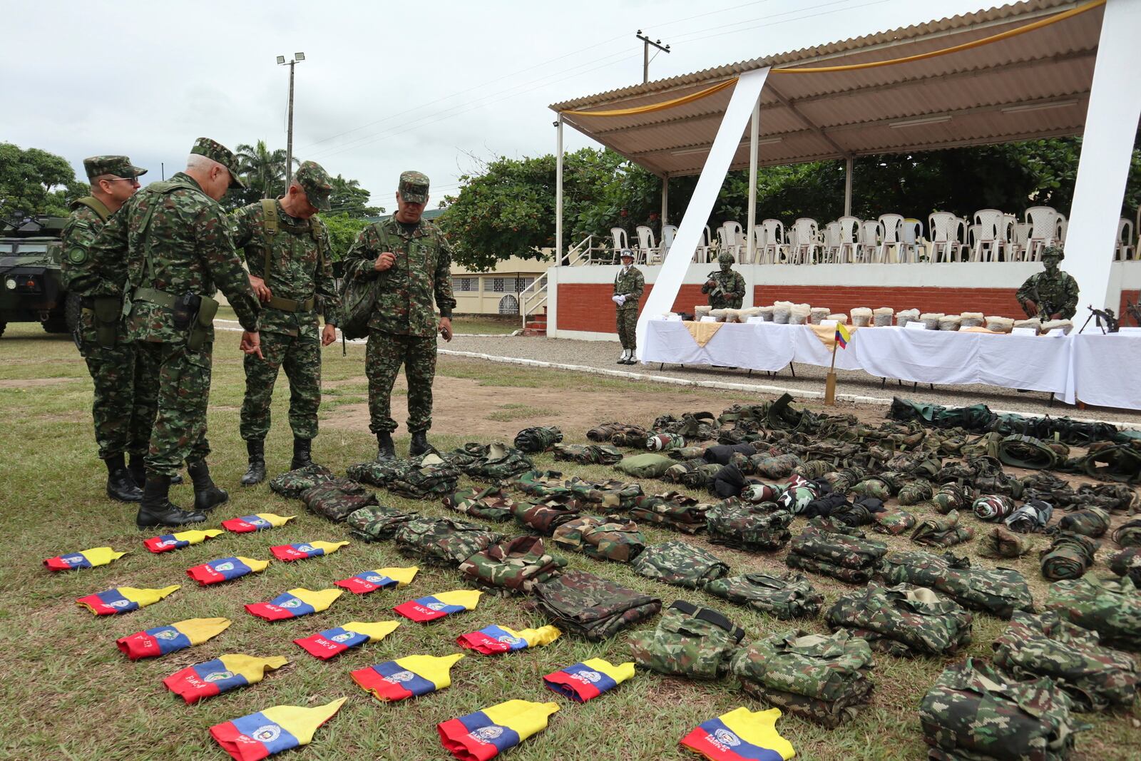 Colombian Army commander Luis Cardozo points at equipment the military says was turned over by members of holdouts from the demobilized Revolutionary Armed Forces of Colombia (FARC), who retreated to the Army after being driven out of the Catatumbo region by National Liberation Army (ELN) rebels, in Cúcuta, Colombia, Saturday, Jan. 25, 2025. (AP Photo/Mario Caicedo)