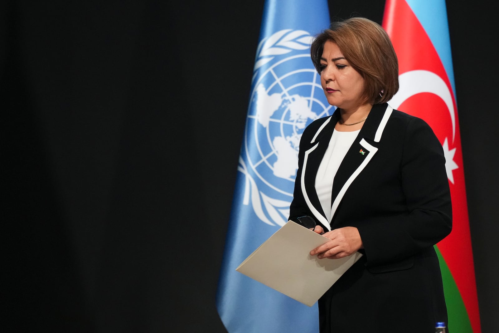 Palestinian Chairperson of Environment Nisreen Tamimi leaves after speaking during a plenary session at the COP29 U.N. Climate Summit, Wednesday, Nov. 20, 2024, in Baku, Azerbaijan. (AP Photo/Sergei Grits)