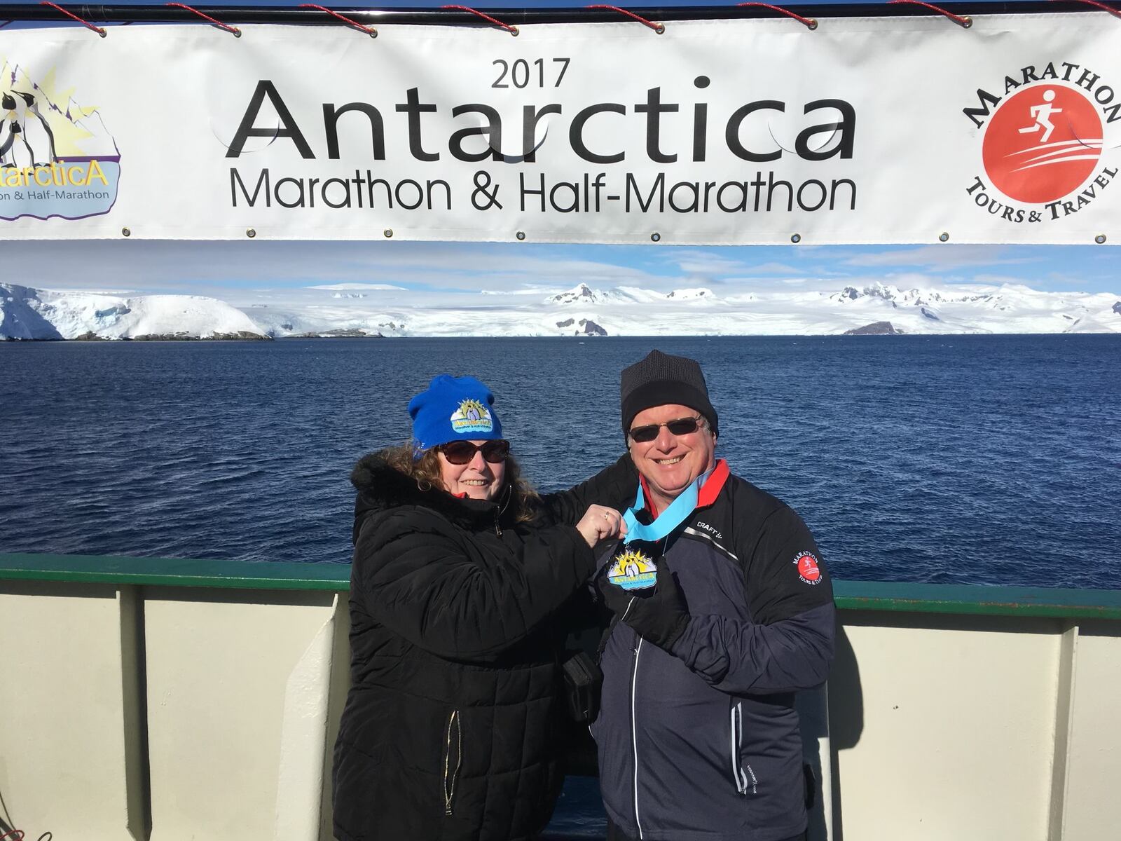 Frank Williams, and his wife, Debbie, with the Antarctica coast behind them. CONTRIBUTED