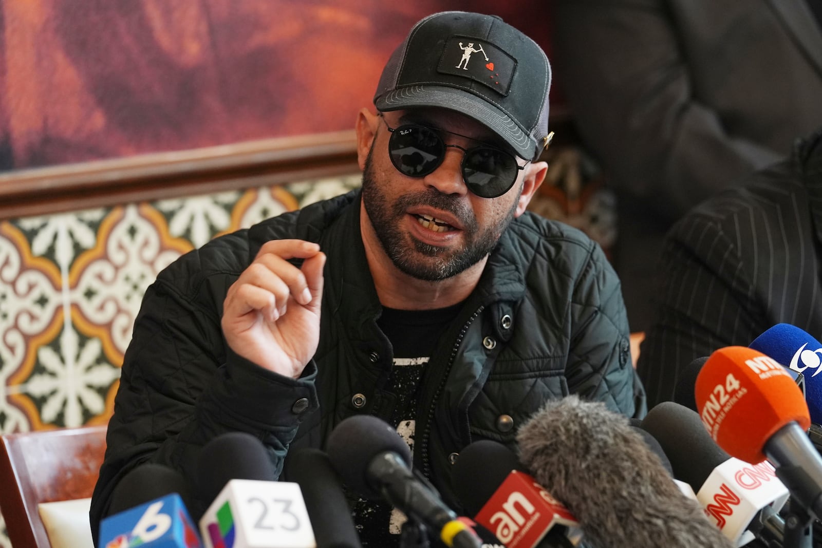 Enrique Tarrio, the former national Proud Boys leader whose 22-year sentence on seditious conspiracy charges was pardoned by President Donald Trump, speaks during a news conference, Friday, Jan. 24, 2025, in Doral, Fla. (AP Photo/Marta Lavandier)