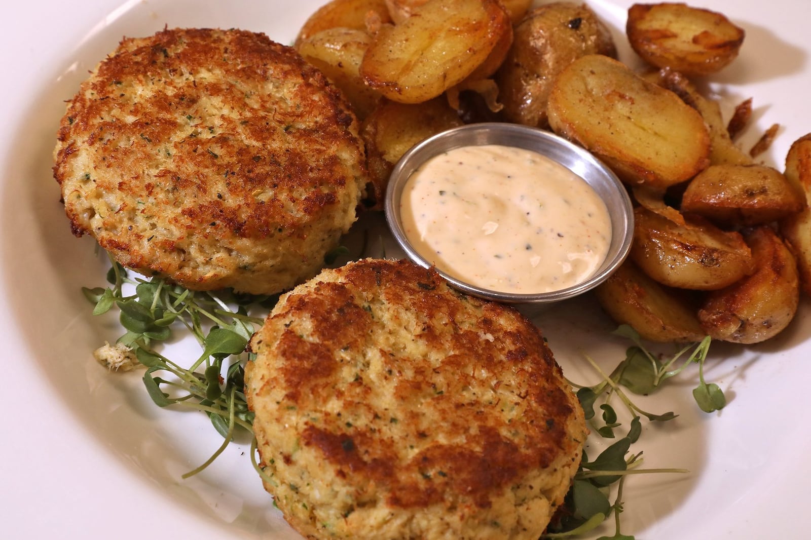 Crab cakes are the most popular item on the menu at Ellie’s Restaurant & Bakery. BILL LACKEY/STAFF