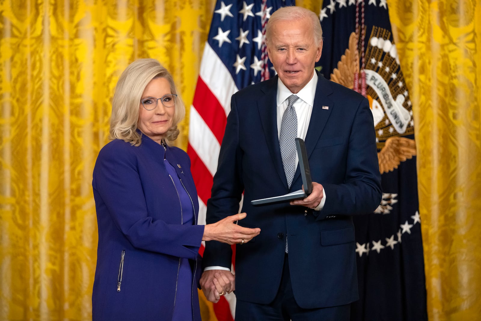 President Joe Biden awards the Presidential Citizens Medal to former Rep. Liz Cheney, R-Wyo., during a ceremony in the East Room at the White House, Thursday, Jan. 2, 2025, in Washington. (AP Photo/Mark Schiefelbein)