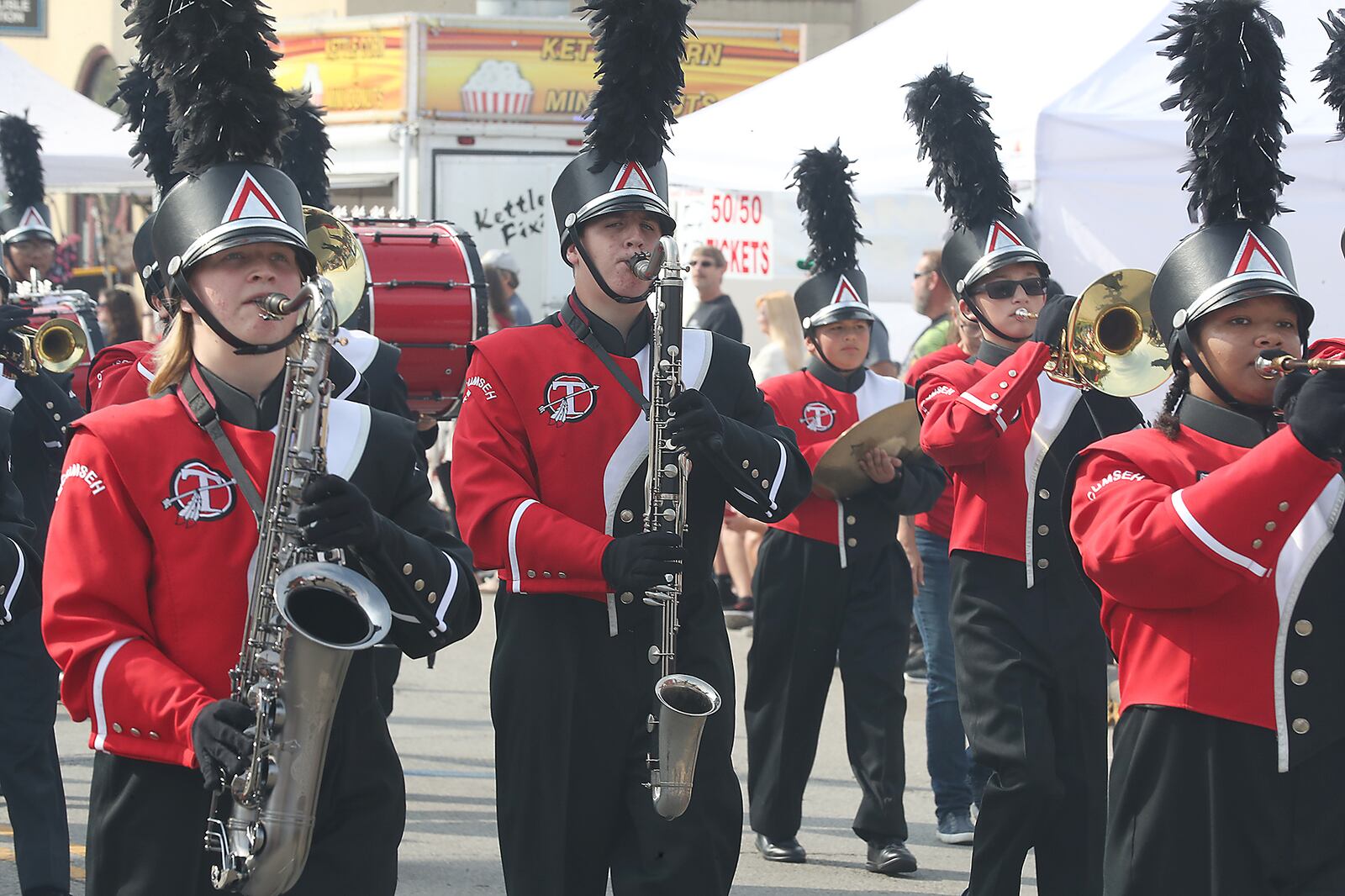 The New Carlisle Heritage of Flight Festival started Saturday with the Airplane Parade down Main Street. Hundreds of people lined the street to see the floats as well as the airplanes towed by vintage tractors. BILL LACKEY/STAFF