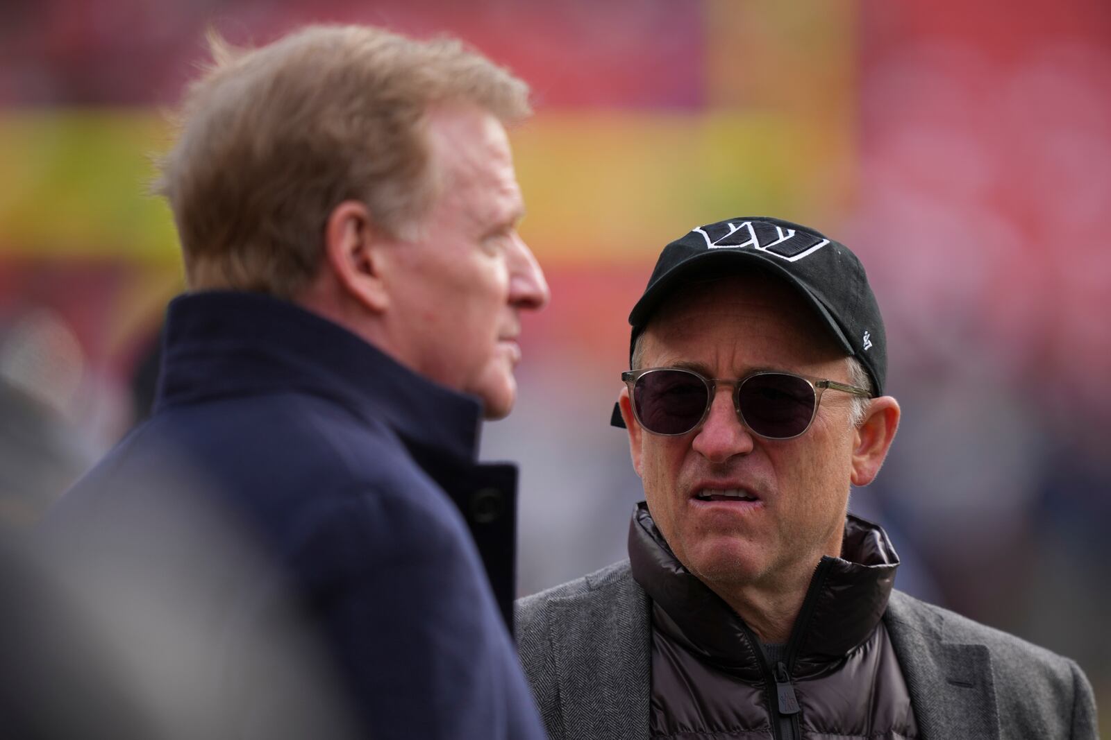 FILE - Washington Commanders managing partner Josh Harris, right, speaks with league commissioner Roger Goodell before an NFL football game against the Tennessee Titans, Sunday, Dec. 1, 2024, in Landover, Md. (AP Photo/Matt Slocum, File)