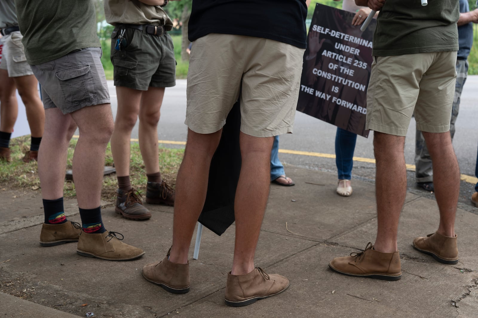 White South Africans demonstrate in support of U.S. President Donald Trump in front of the U.S. embassy in Pretoria, South Africa, Saturday, Feb. 15, 2025. (AP Photo/Jerome Delay)