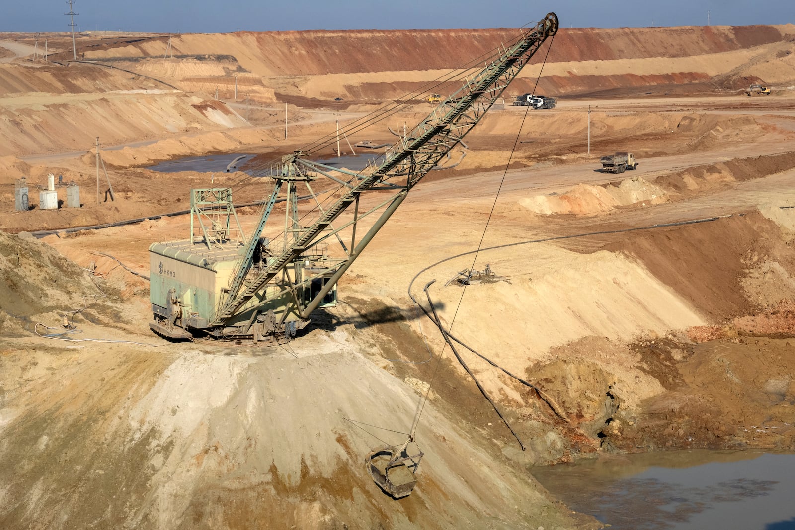 A view of an ilmenite open pit mine in a canyon in the central region of Kirovohrad, Ukraine, Wednesday, Feb. 12, 2025. (AP Photo/Efrem Lukatsky)