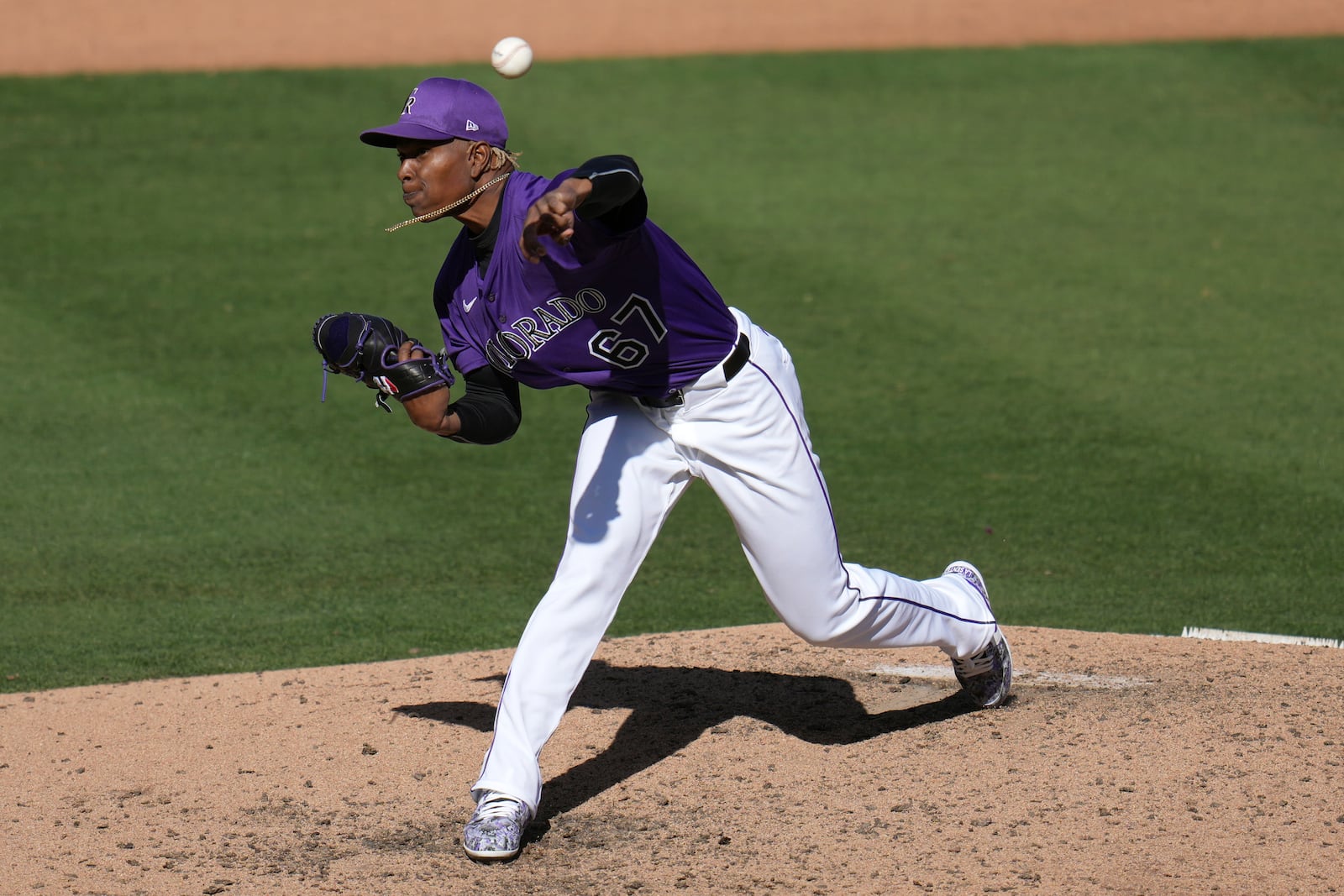 Colorado Rockies pitcher Jefry Yan throws a third strike against Seattle Mariners Jacob Nottingham during the seventh inning of a spring training baseball game, Sunday, March 2, 2025, in Scottsdale, Ariz. (AP Photo/Ross D. Franklin)