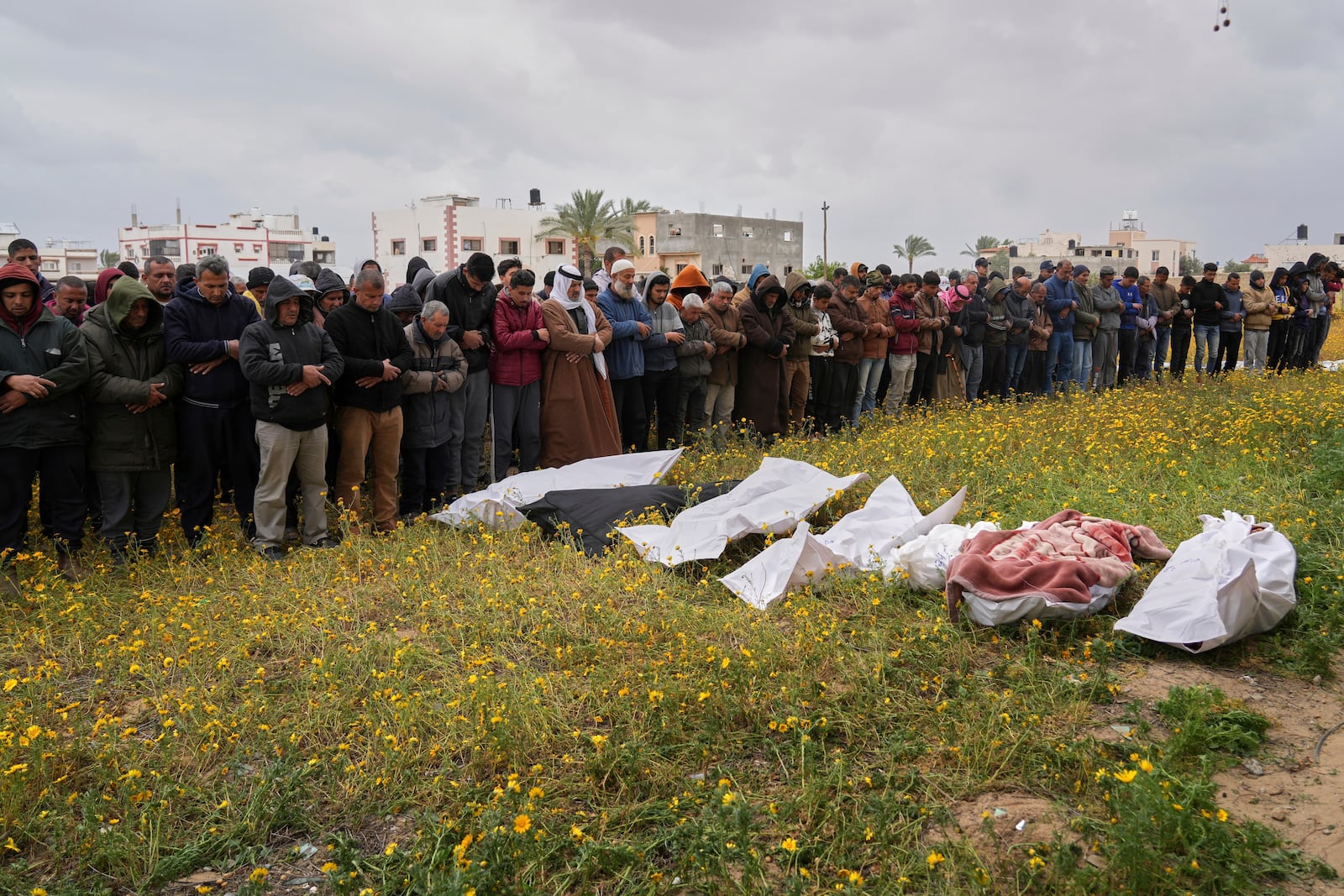 Palestinians pray during a funeral for victims of Israeli army strikes in Khan Younis, southern Gaza Strip, Thursday, March 20, 2025. (AP Photo/Abdel Kareem Hana)