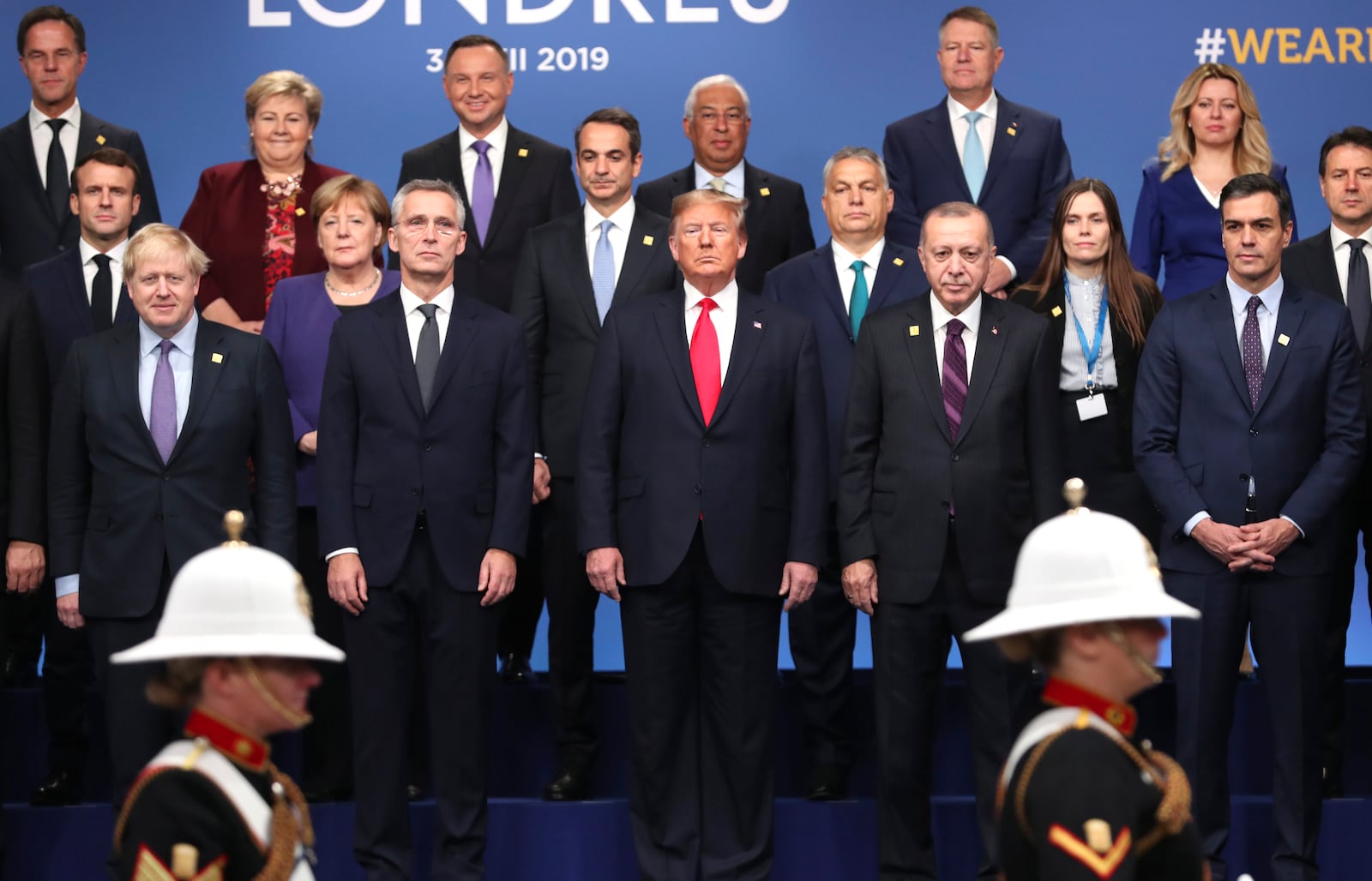 FILE - In this Dec. 4, 2019, photo, from front row left, British Prime Minister Boris Johnson, NATO Secretary General Jens Stoltenberg, U.S. President Donald Trump, Turkish President Recep Tayyip Erdogan and Spanish Prime Minister Pedro Sanchez attend a ceremony event during a NATO leaders meeting at The Grove hotel and resort in Watford, Hertfordshire, England. Three years into the Trump presidency, America's new place in the world is coming into focus, with influence waning from NATO meeting rooms to the Middle East to the capital cities of key allies. And in many ways, that's just fine with the White House.(AP Photo/Francisco Seco)