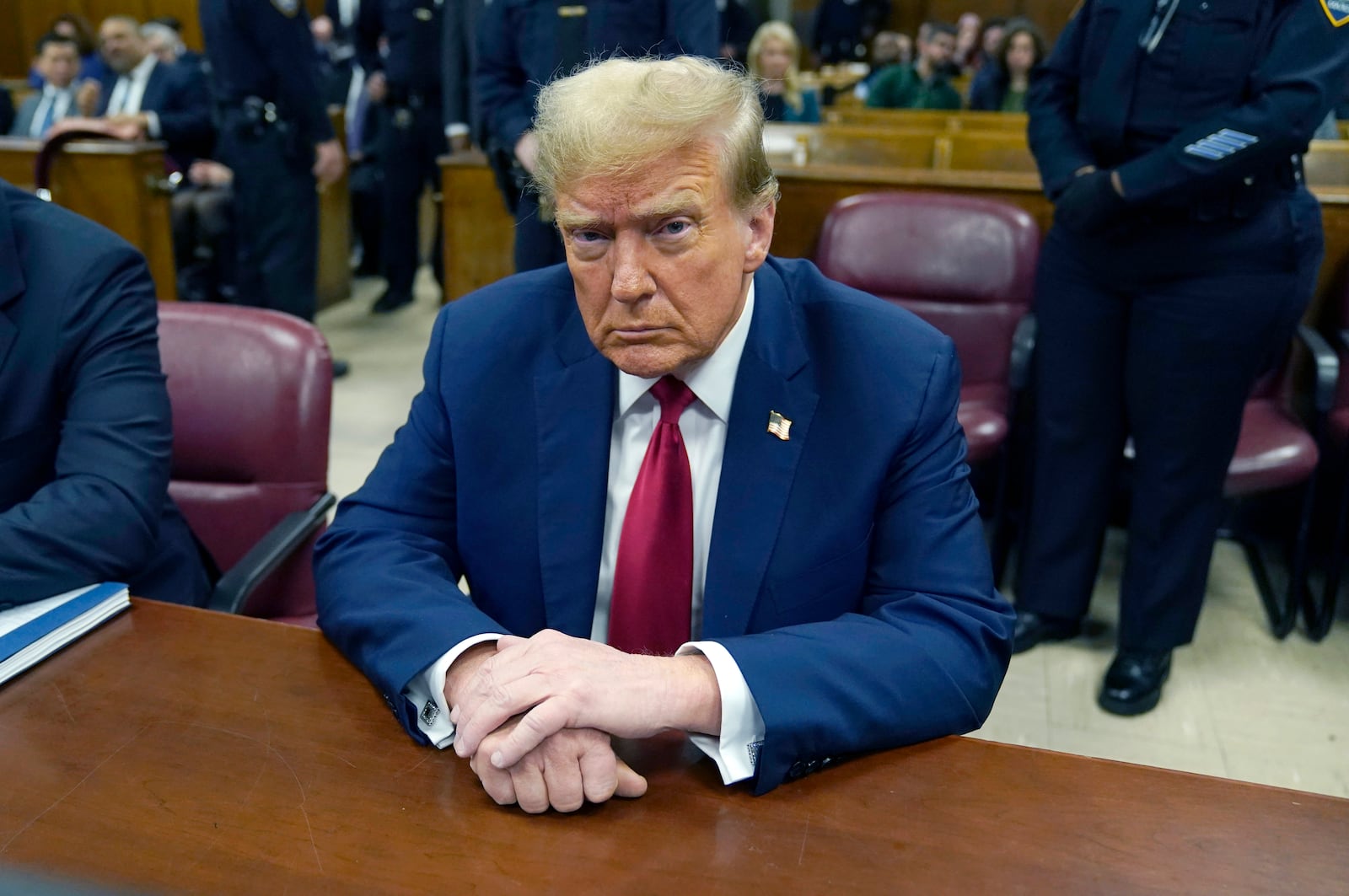 FILE - Former U.S. President Donald Trump attends his trial for allegedly covering up hush money payments linked to extramarital affairs at Manhattan Criminal Court in New York, Tuesday, April 23, 2024. (Timothy A. Clary/Pool Photo via AP, File)