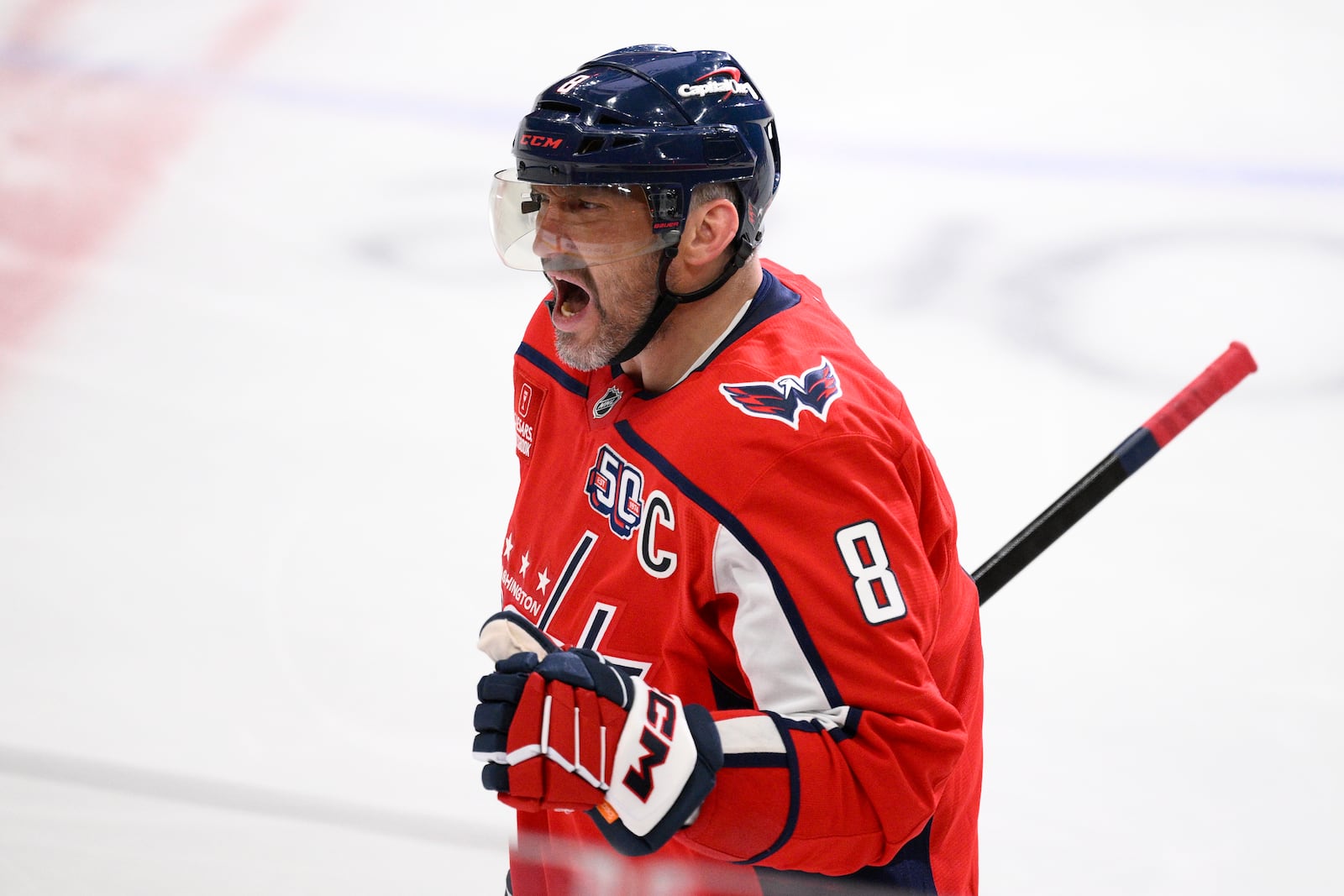 Washington Capitals left wing Alex Ovechkin celebrates his goal during the third period of an NHL hockey game against the Calgary Flames as he skates towards the bench, Tuesday, Feb. 25, 2025, in Washington. (AP Photo/Nick Wass)