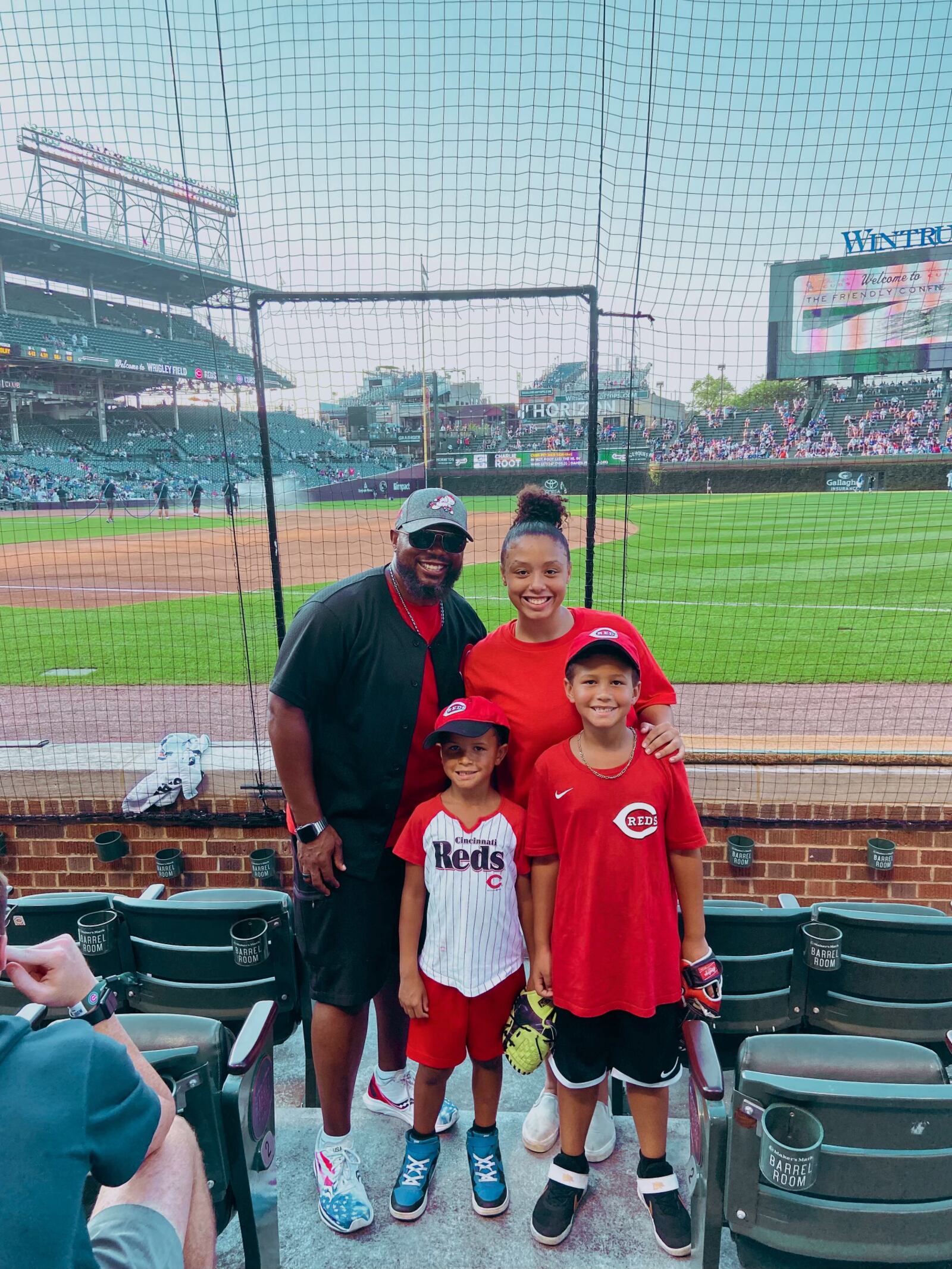 Brandon Peterson, left, is pictured with his  daughter Abigail, top right, son Brandon Jr., front right, and son Noah at on Tuesday, July 27, 2021, at Wrigley Field in Chicago.