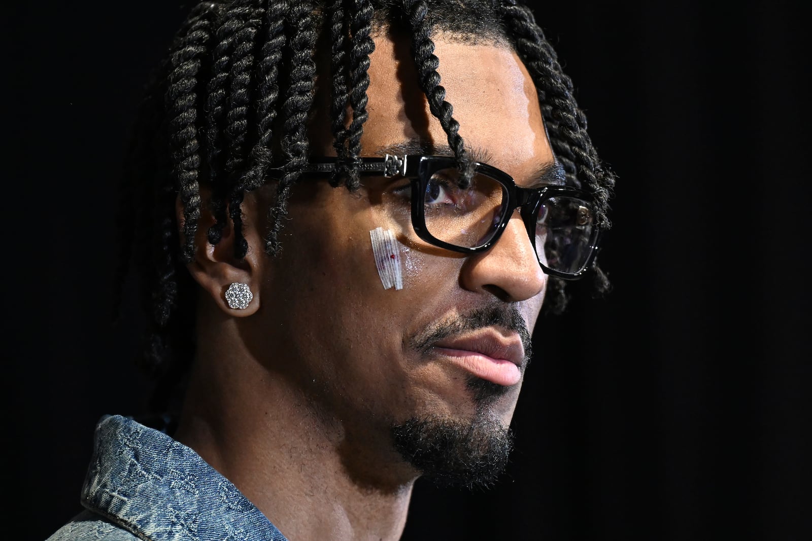 Washington Commanders quarterback Jayden Daniels speaks at a news conference after an NFL wild-card playoff football game against the Tampa Bay Buccaneers in Tampa, Fla., Sunday, Jan. 12, 2025. (AP Photo/Jason Behnken)