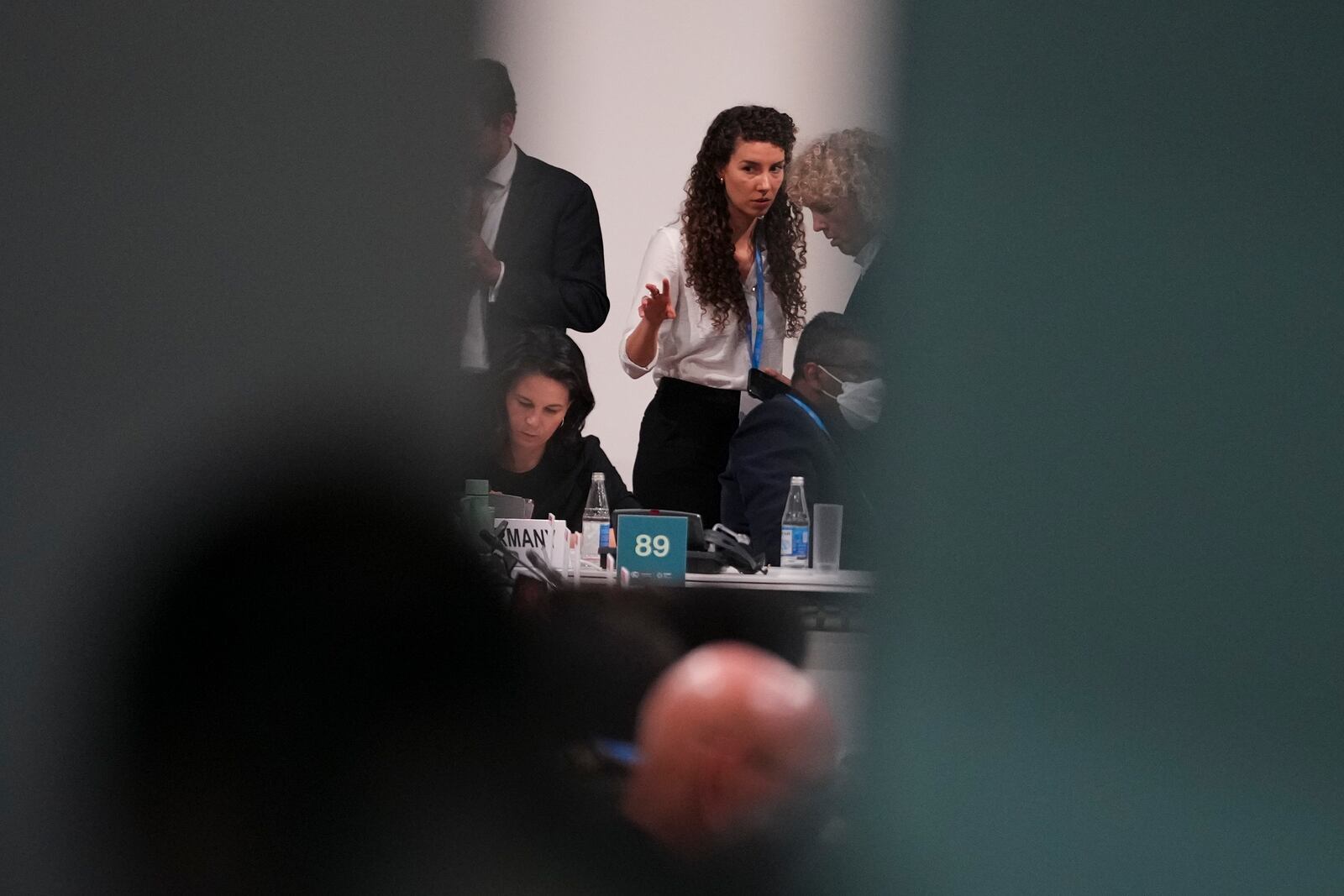 Jennifer Morgan, Germany climate envoy, right, and Joanna MacGregor, senior advisor for U.N. climate change, talk near Germany Foreign Minister Annalena Baerbock, bottom left, in a meeting room at the COP29 U.N. Climate Summit, Saturday, Nov. 23, 2024, in Baku, Azerbaijan. (AP Photo/Peter Dejong)