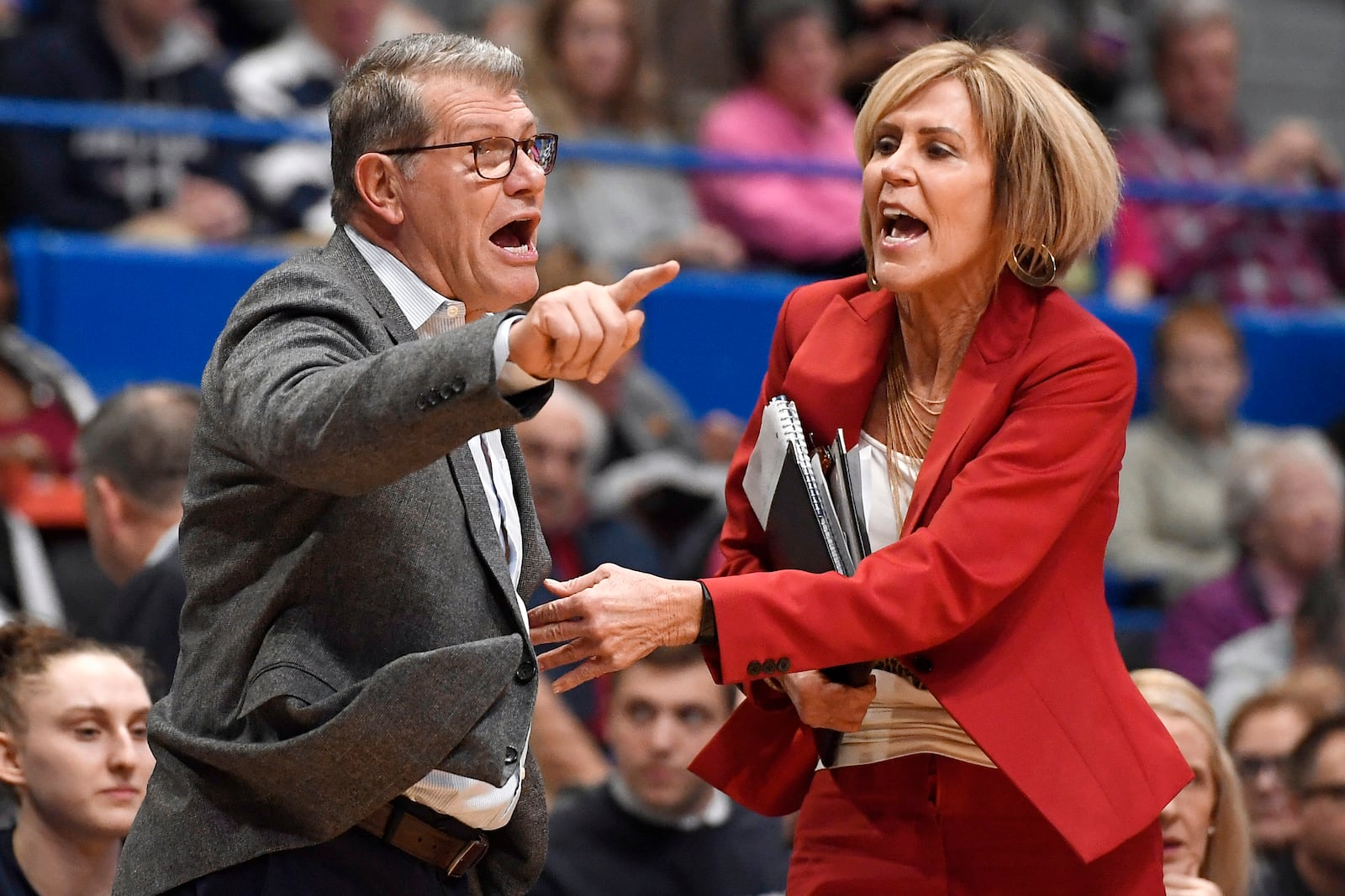 FILE - UConn coach Geno Auriemma, left, is held back by associate head coach Chris Dailey, right, as he argues a call during the first half of the an NCAA college basketball game against Baylor, Thursday, Jan. 9, 2020, in Hartford, Conn. (AP Photo/Jessica Hill, File)