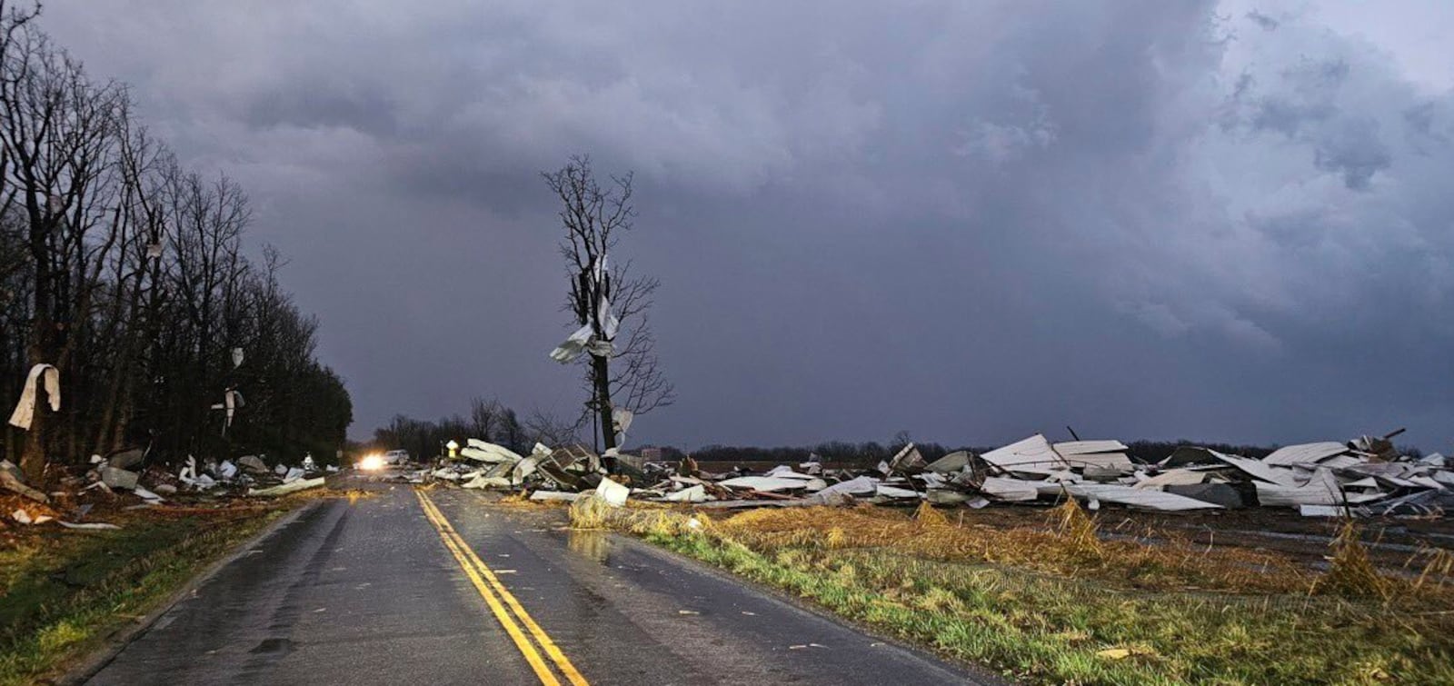 Debris covers the road during a severe storm passed the area north of Seymour, Mo., in Webster County late Friday, March 14, 2025. (Trooper Austin James/Missouri State Highway Patrol via AP)