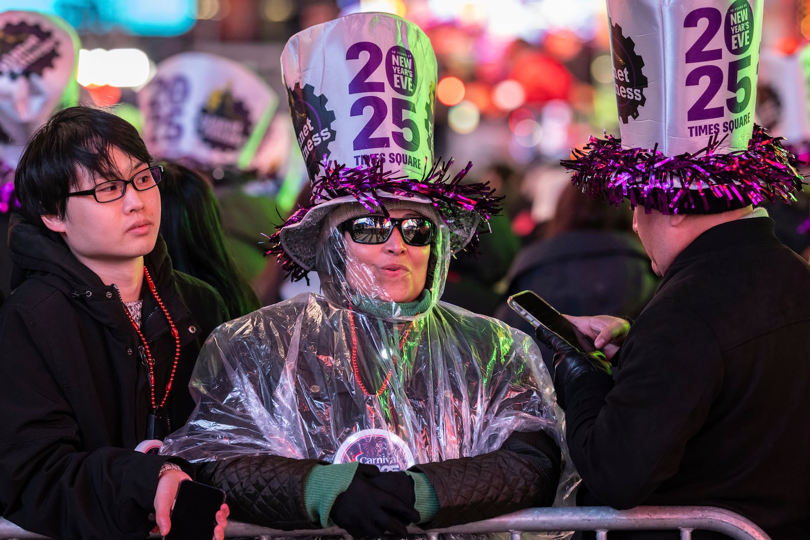 Revellers celebrate in New York's Times Square as they attend a New Year's Eve celebration, Tuesday, Dec. 31, 2024, in New York. (AP Photo/Stefan Jeremiah)