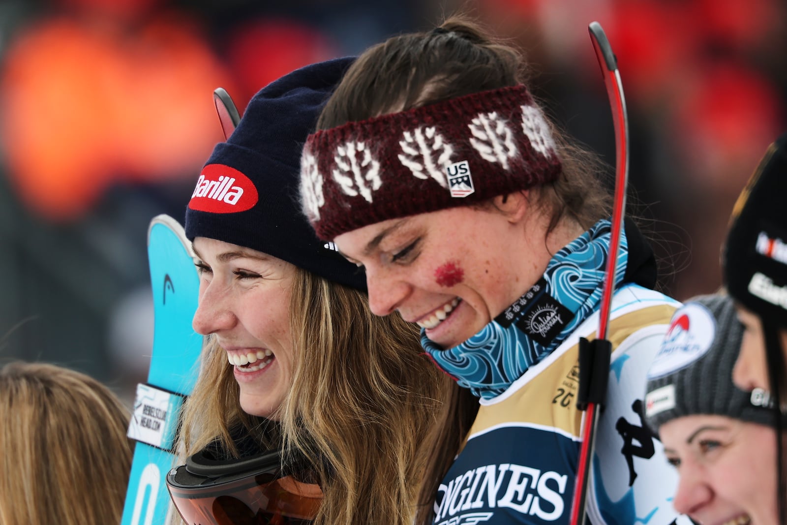 United States' Mikaela Shiffrin, left, and teammate United States' Breezy Johnson celebrate on the podium after winning the gold medal in a women's team combined event, at the Alpine Ski World Championships, in Saalbach-Hinterglemm, Austria, Tuesday, Feb. 11, 2025. (AP Photo/Marco Trovati)