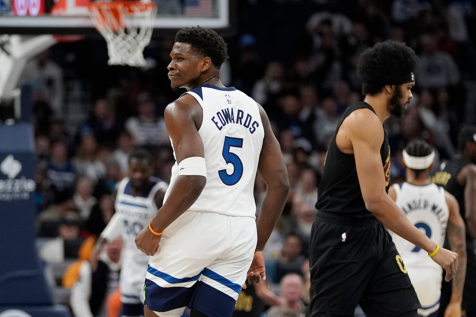 Minnesota Timberwolves guard Anthony Edwards (5) reacts after making a 3-point basket during the first half of an NBA basketball game against the Cleveland Cavaliers, Saturday, Jan. 18, 2025, in Minneapolis. (AP Photo/Abbie Parr)