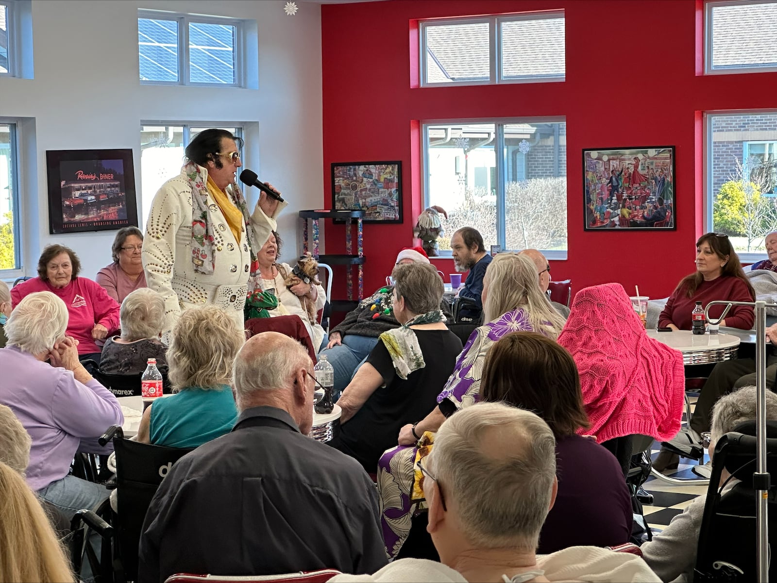 Elvis talks to residents at Austin Trace Health and Rehabilitation, which was ranked the highest in resident satisfaction in Montgomery County in a recent state survey. COURTESY OF NICOLE GROVE