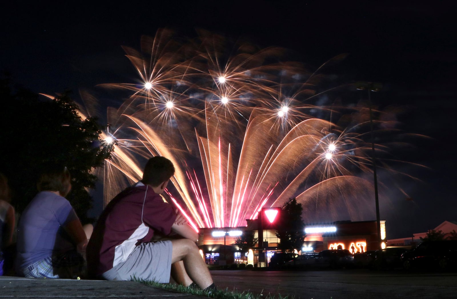 IMAGE DISTRIBUTED FOR WASHINGTON PRIME GROUP - People watch the fIreworks display at the Red, White and Brew Event at Fairfield Commons Mall on Saturday, July 7, 2018, in Beavercreek, Ohio. (Tom Uhlman/AP Images for Washington Prime Group)