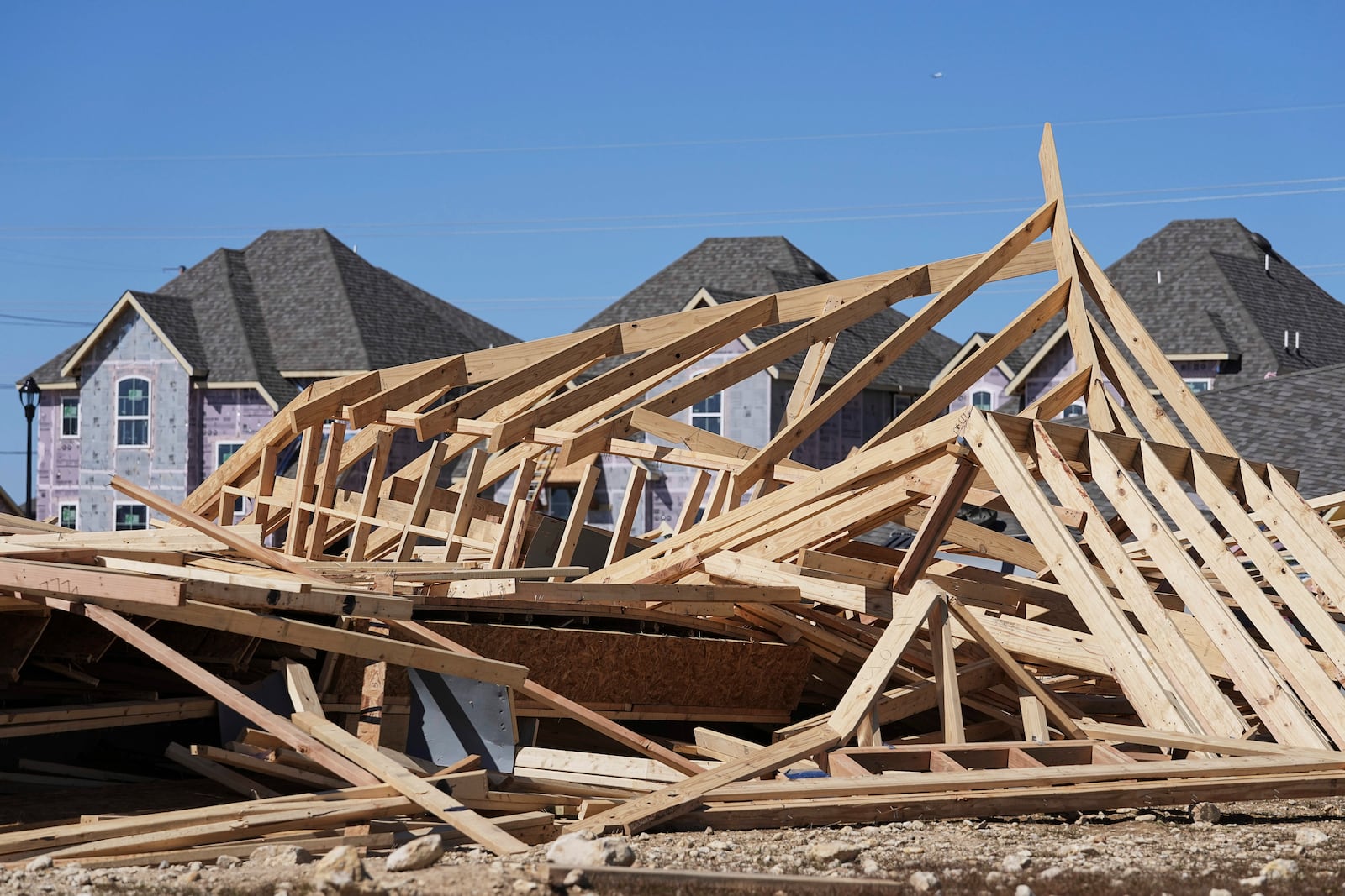 Homes that were under construction sit destroyed after recent severe weather passed through the area in Haslet, Texas, Wednesday, March 5, 2025. (AP Photo/Tony Gutierrez)