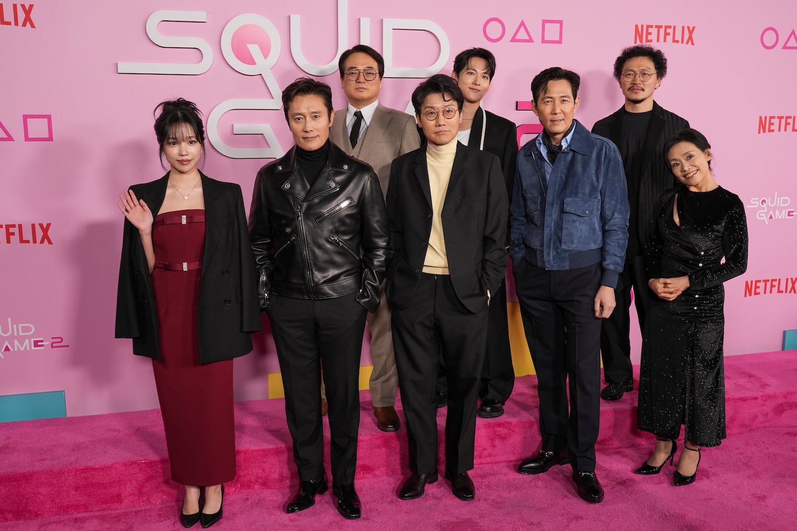 Jo Yu-ri, from left, Lee Byung-hun, Lee Seo-hwan, Hwang Dong-hyuk, Im Si-wan, Lee Jung-jae, Yang Dong-geun, and Kang Ae-sim arrive at the premiere of the second season of "Squid Game" on Thursday, Dec. 12, 2024, at Los Angeles City College in Los Angeles. (AP Photo/Chris Pizzello)