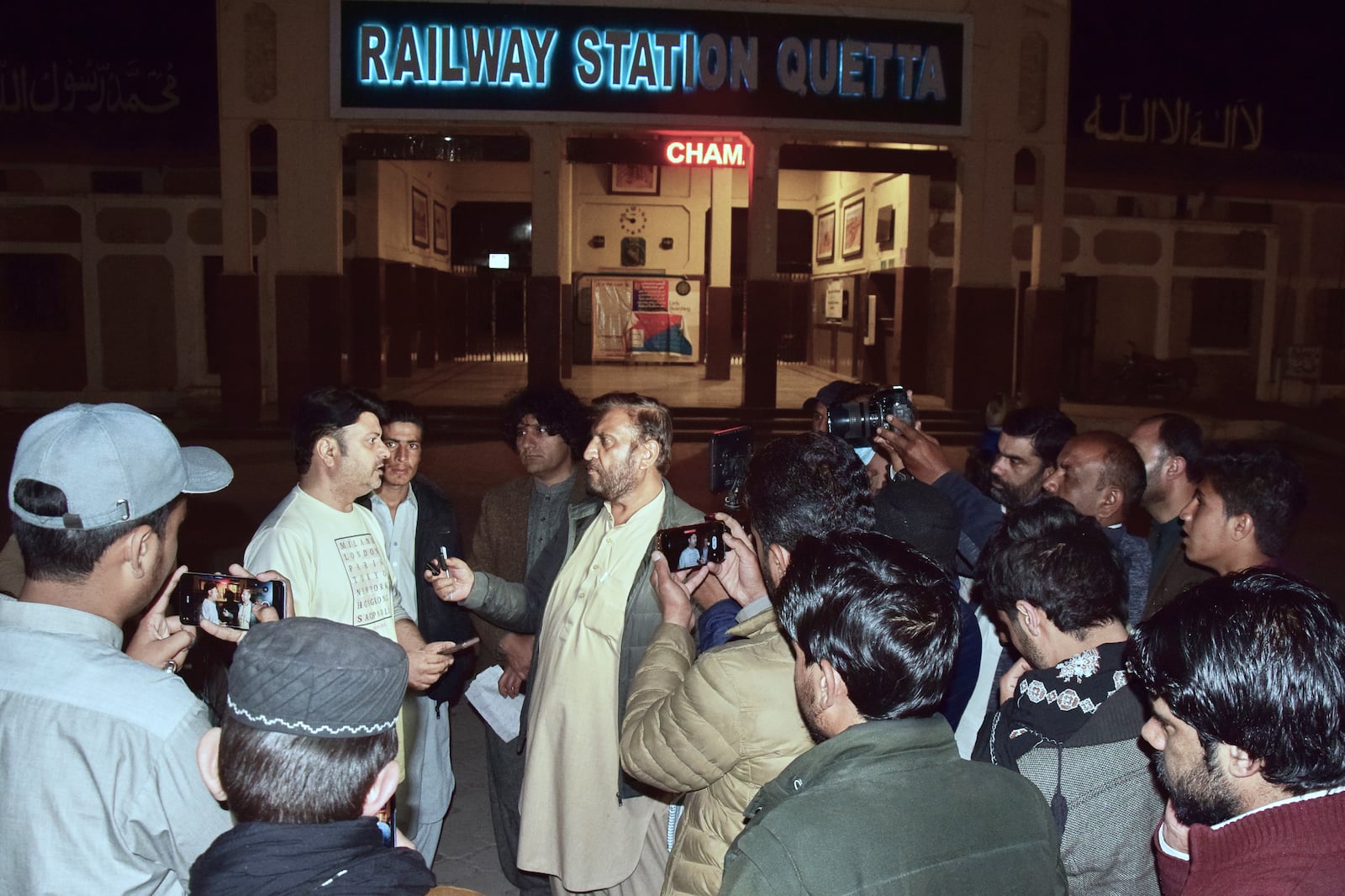 Relatives of passengers of a train, which is attacked by insurgents, gather to get information about passengers from special counter at a railway station in Quetta, Pakistan, Tuesday, March 11, 2025. (AP Photo/Arshad Butt)