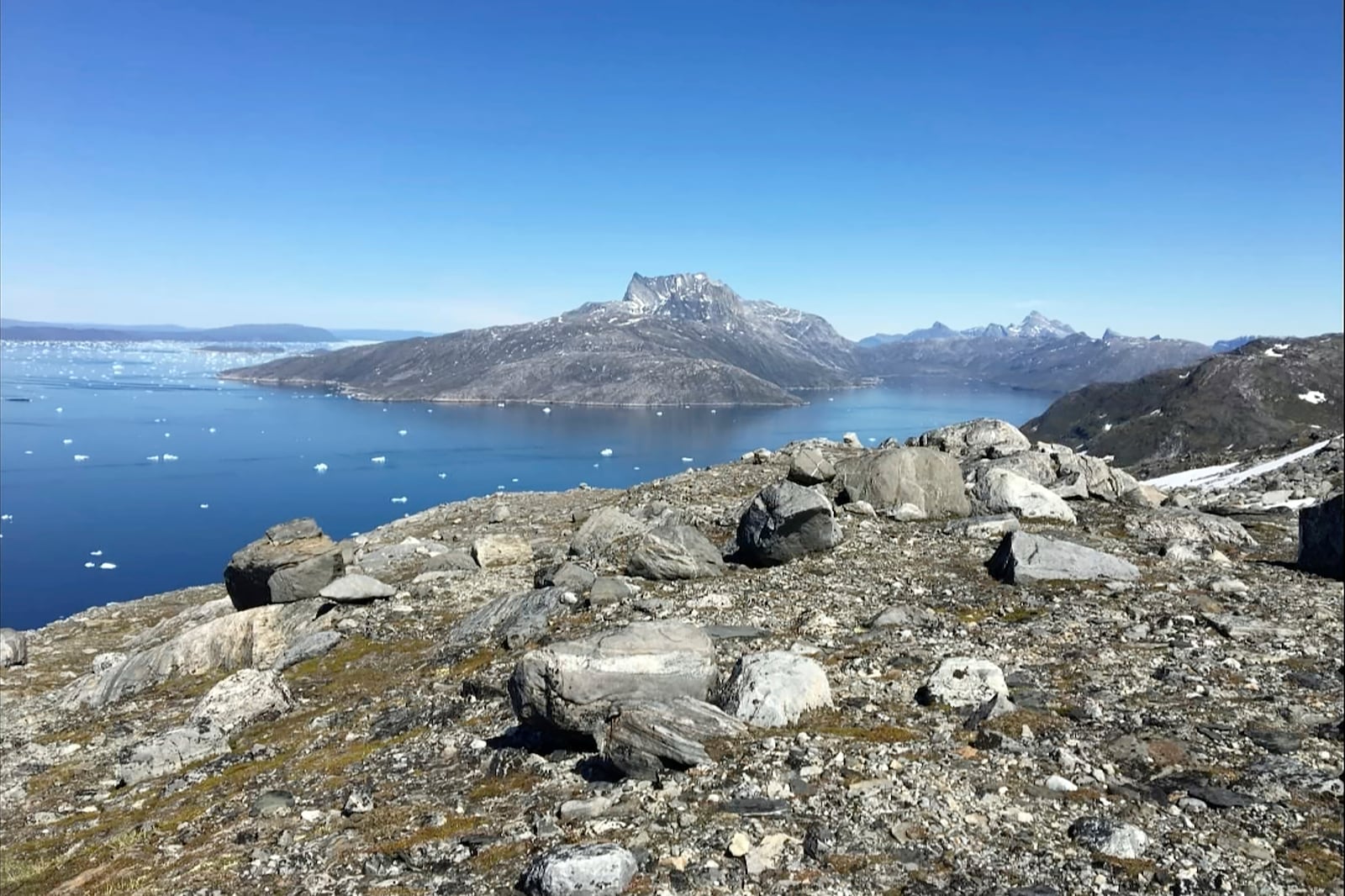 FILE - Small pieces of ice float in the water in Nuuk Fjord, Greenland, on June 15, 2019. (AP Photo/Keith Virgo, File)