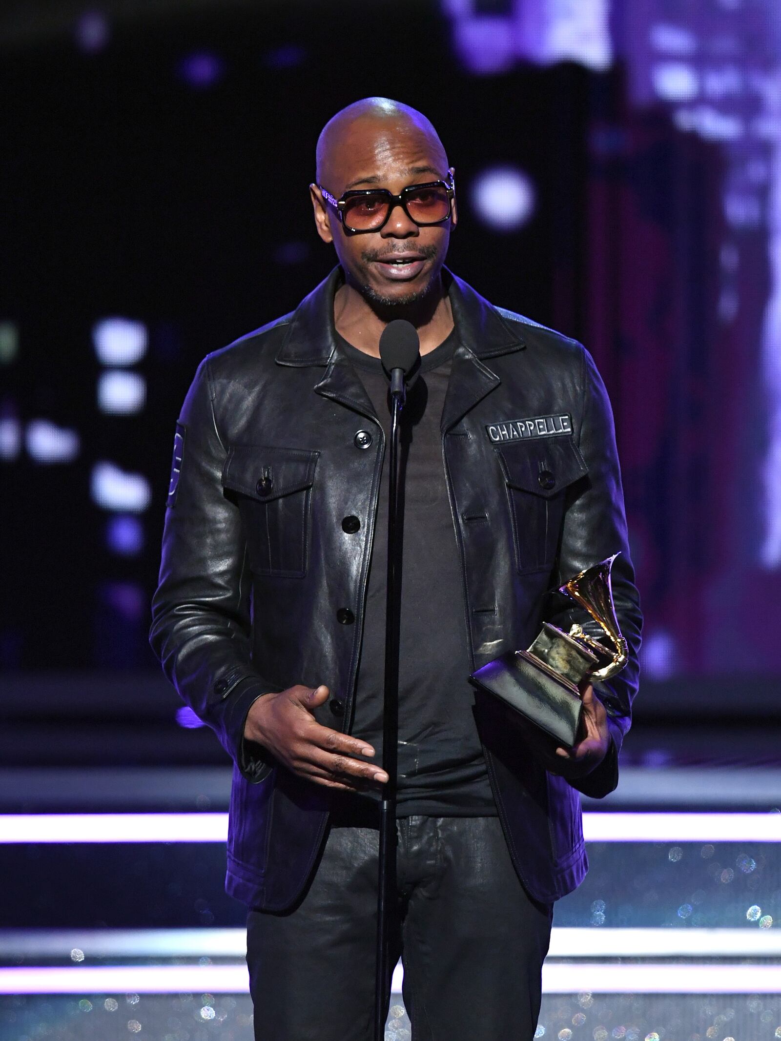 NEW YORK, NY - JANUARY 28:  Comedian Dave Chappelle speaks onstage during the 60th Annual GRAMMY Awards at Madison Square Garden on January 28, 2018 in New York City.  (Photo by Kevin Winter/Getty Images for NARAS)