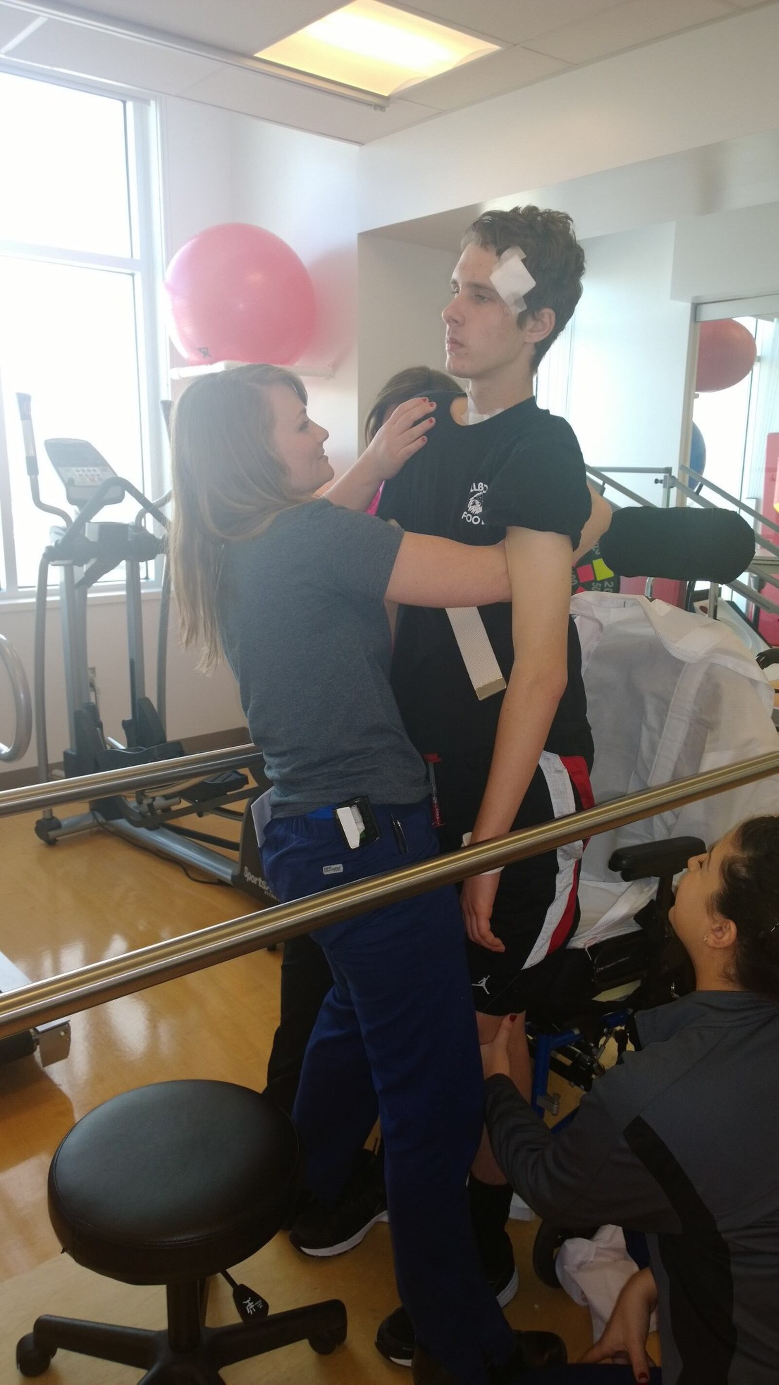 Payne Sigman, of Bellbrook, who a suffered a traumatic brain injury following a car accident in January 2014. He spent more than 70 days in the hospital, first at Miami Valley Hospital and then at Nationwide Children’s Hospital in Columbus for eight weeks of inpatient rehabilitation. This was his first time standing after the accident. CONTRIBUTED