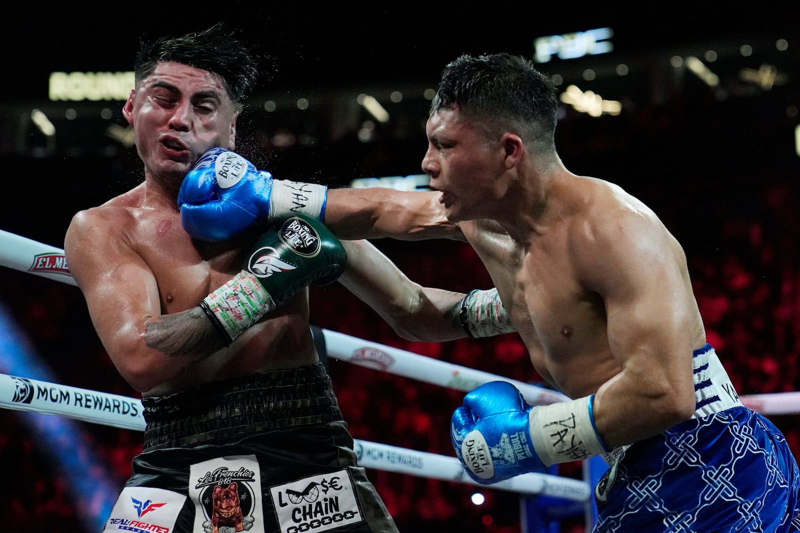 Isaac Cruz hits Angel Fierro in a super lightweight boxing match Saturday, Feb. 1, 2025, in Las Vegas. (AP Photo/John Locher)