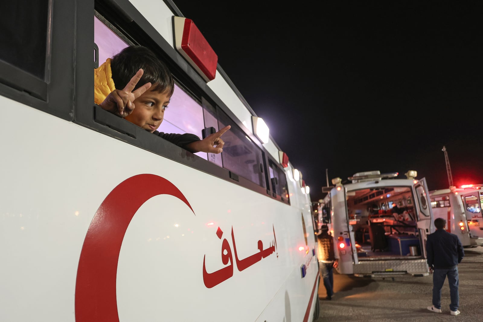 A Palestinian boy injured in the Israeli military's ground and air offensive on Gaza, looks from an ambulance as the first group of sick Gaza children arrives in Jordan for medical treatment at the King Hussein Bridge border crossing on Tuesday, March 4, 2025. (AP Photo/Raad Adayleh)