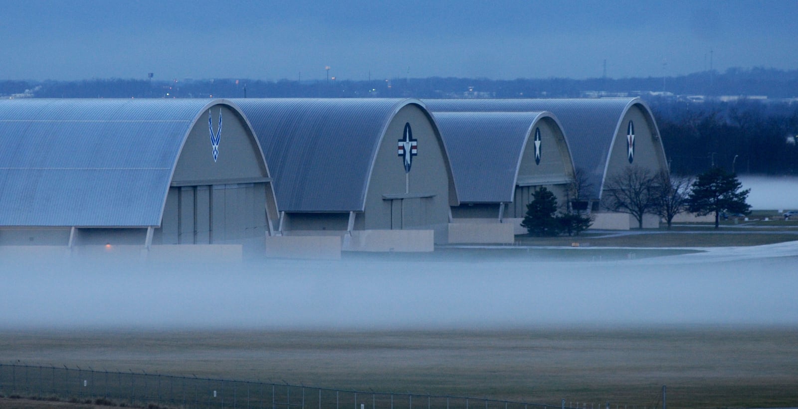 Fog surrounds the National Museum of the U.S. Air Force after warm rain soaked the cold ground.  The new fourth building, at left, is scheduled to open in June of 2016 and includes Experimental and Research, Presidential and Global Reach Aircraft.  MARSHALL GORBY / STAFF